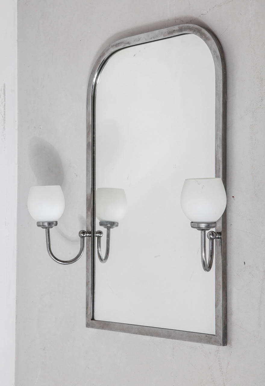 A beautiful stylish large mirror with a chrome frame and adjustable lighting in opal glass on both sides. Stylish in your bathroom or at the entrance of your house.