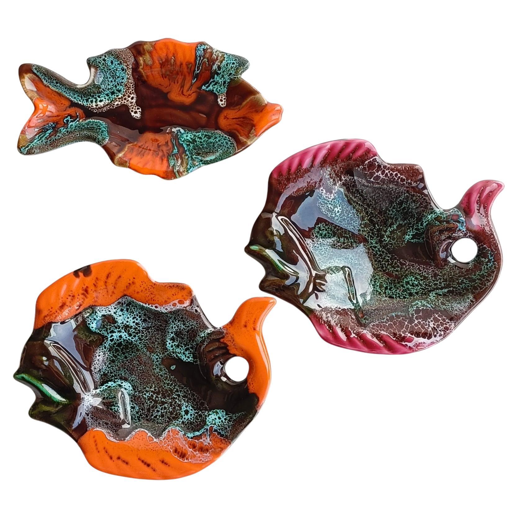 Delightful set of three vintage Vallauris fish-shaped ceramic trays. Crafted with meticulous attention to detail, they feature the iconic 