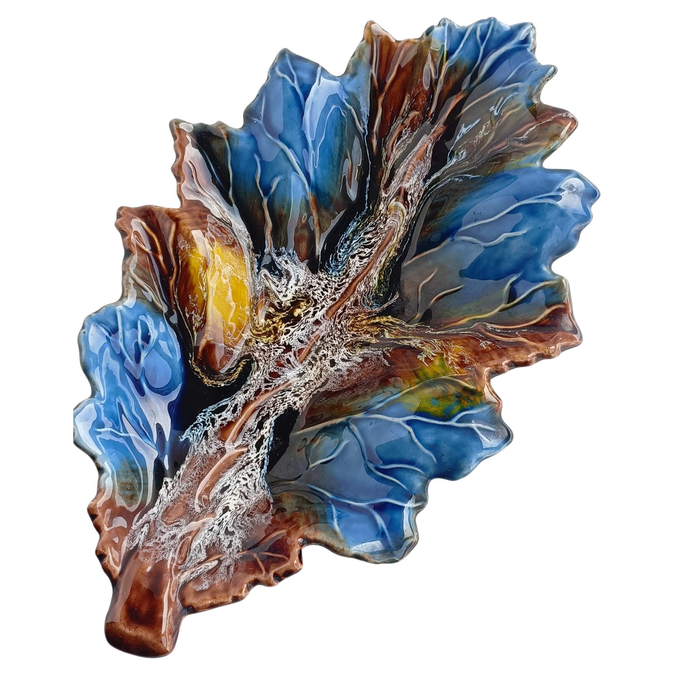 
Step into the timeless elegance of mid-century France with this exquisite vintage French Vallauris signed Fat Lava large ceramic leaf sculpture-tray, a captivating masterpiece handcrafted in Vallauris, South-France, circa the 1950s. 

Featuring