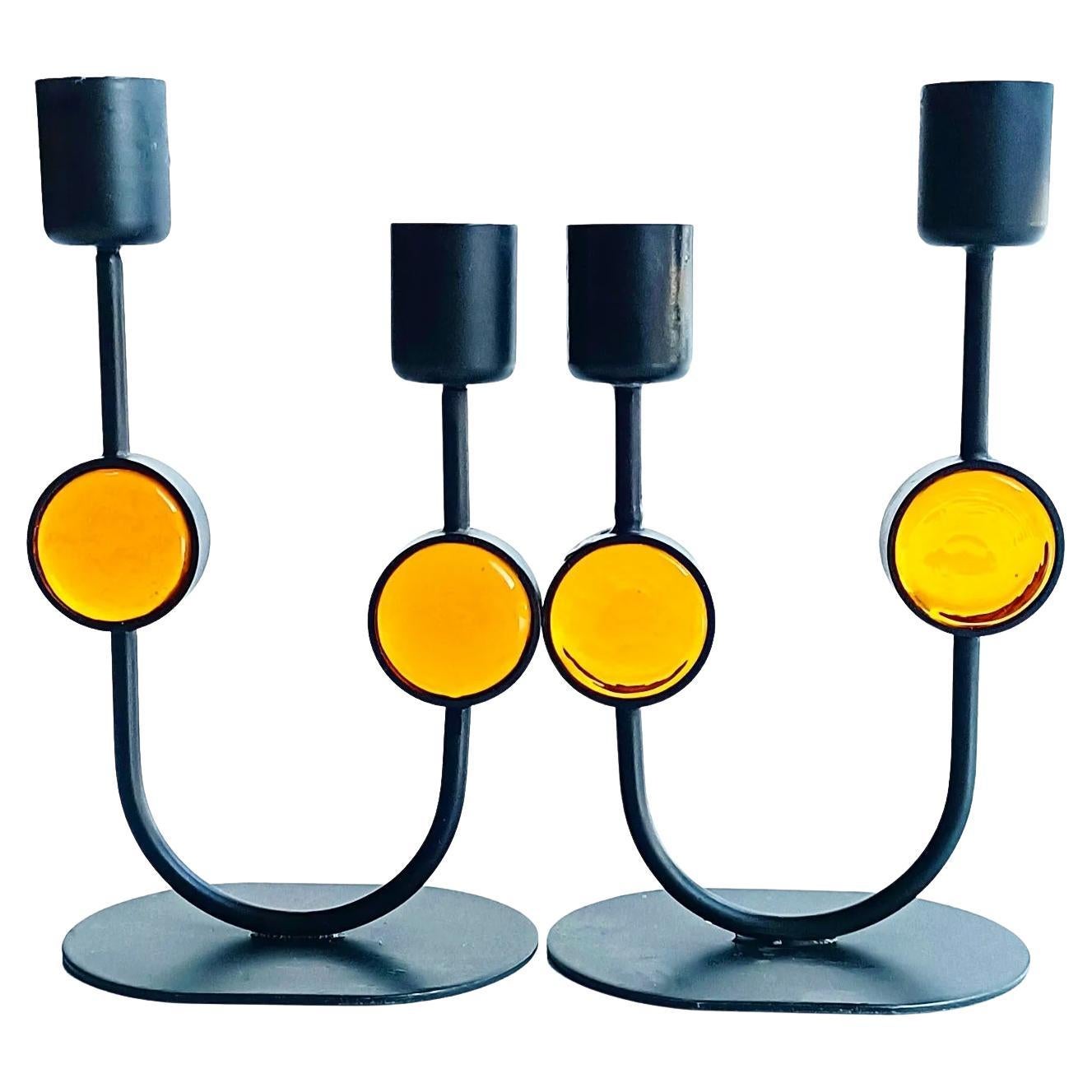 Beyond cool pair of candle holders designed by Gunnar Ander for Ystad-Metal. Handcrafted in Sweden during the 1950s, these candle holders are a testament to Ander's unparalleled creativity and craftsmanship.

Made from durable metal and vibrant