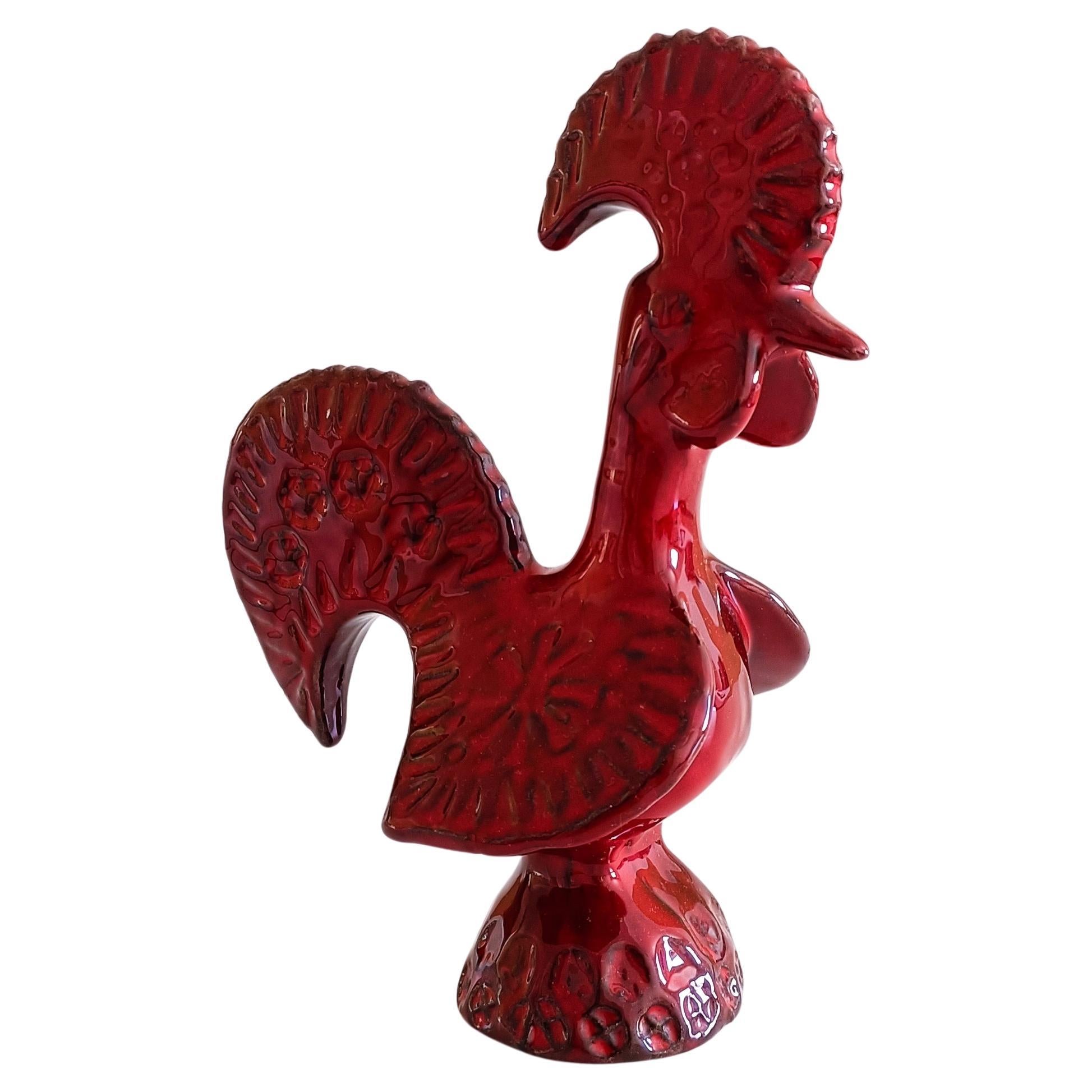 Introducing a stunning and exceptionally rare Mid-Century piece: a red glaze ceramic rooster designed by Aldo Londi for Bitossi Ceramiche. Hand-produced in Italy during the 1960s, this sculpture is a true collector's gem.

Key Features:

Designer: