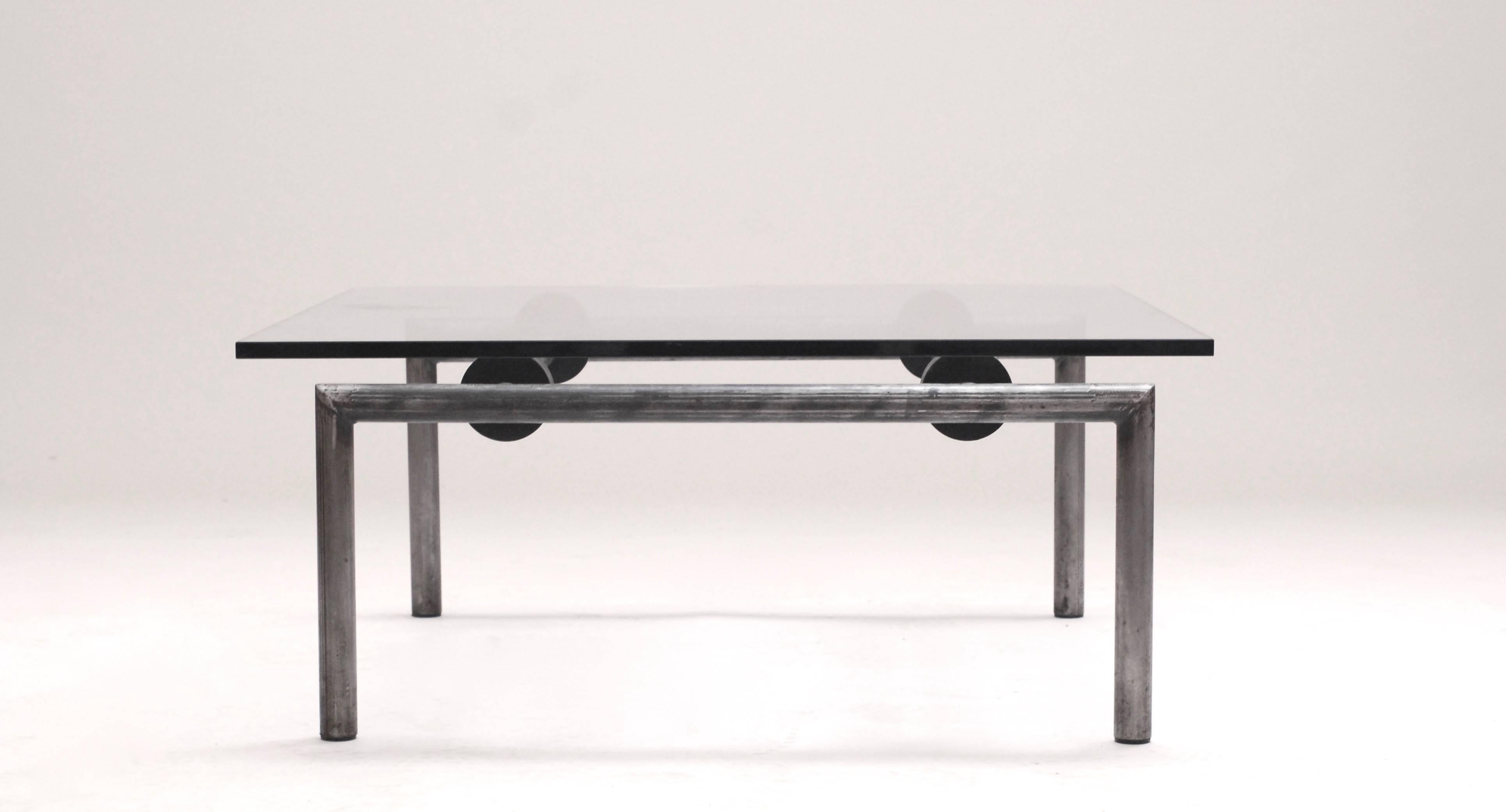 Great Postmodern Brutalist coffee table by Pol Quadens. This table was made as a try out for a design gallery.
This unique piece has been acquired directly from the gallery owner.
A round hollow tubular frame with four rubber rounds which carry