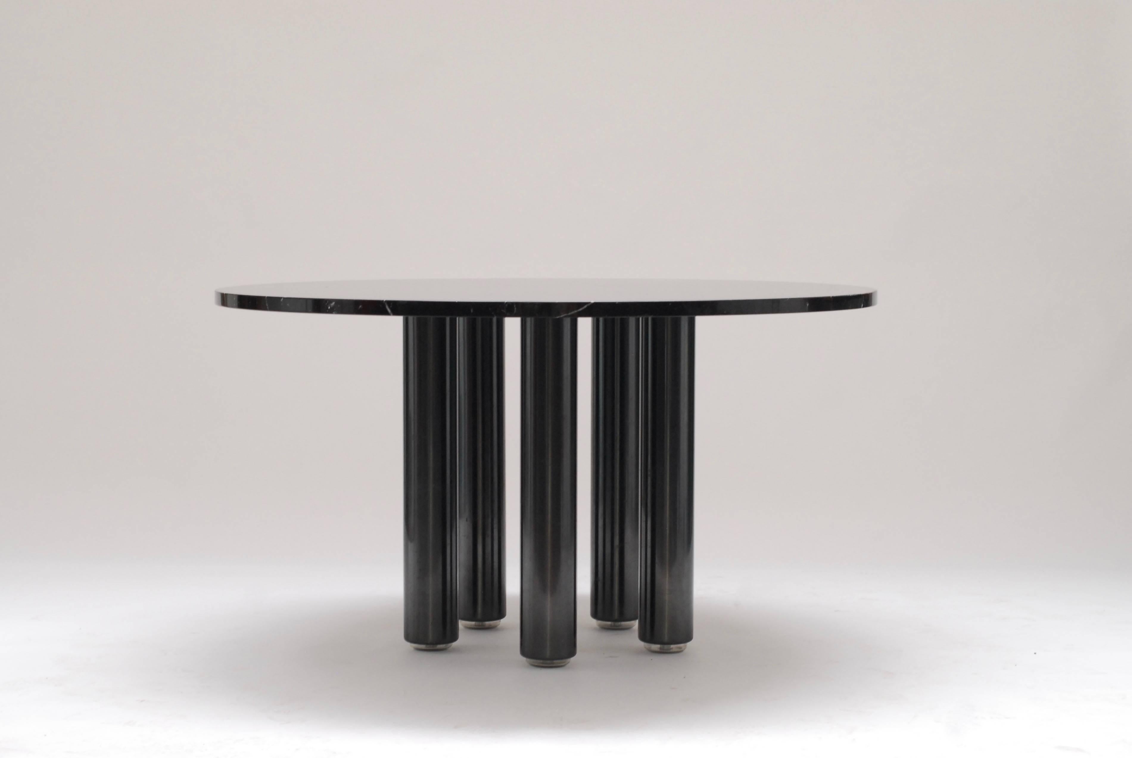Rather rare dining table designed by Marco Zanuso for Zanotta in 1979. A black marble base resting on five metal legs which are adjustable in height.
Great combination of formal approach in material and color on one hand and playfulness in the