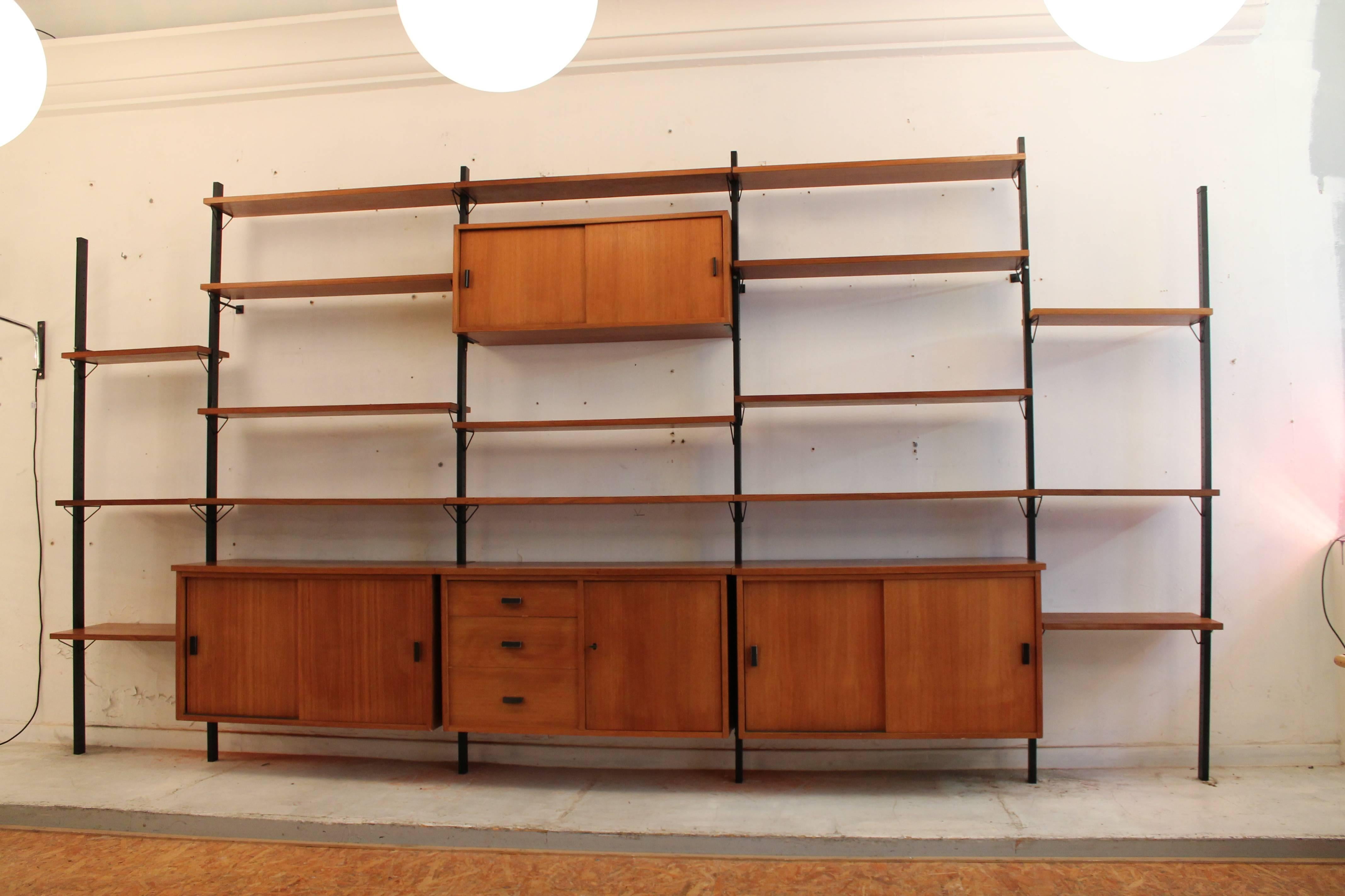 Mid-Century Modern wall unit shelving system, Pira Sweden, 1960. Modernist wall unit made by Pira ​​of metal and walnut veneer. This wall unit is fully modular good original condition , with normal users wear all parts are there we ship world wide ,