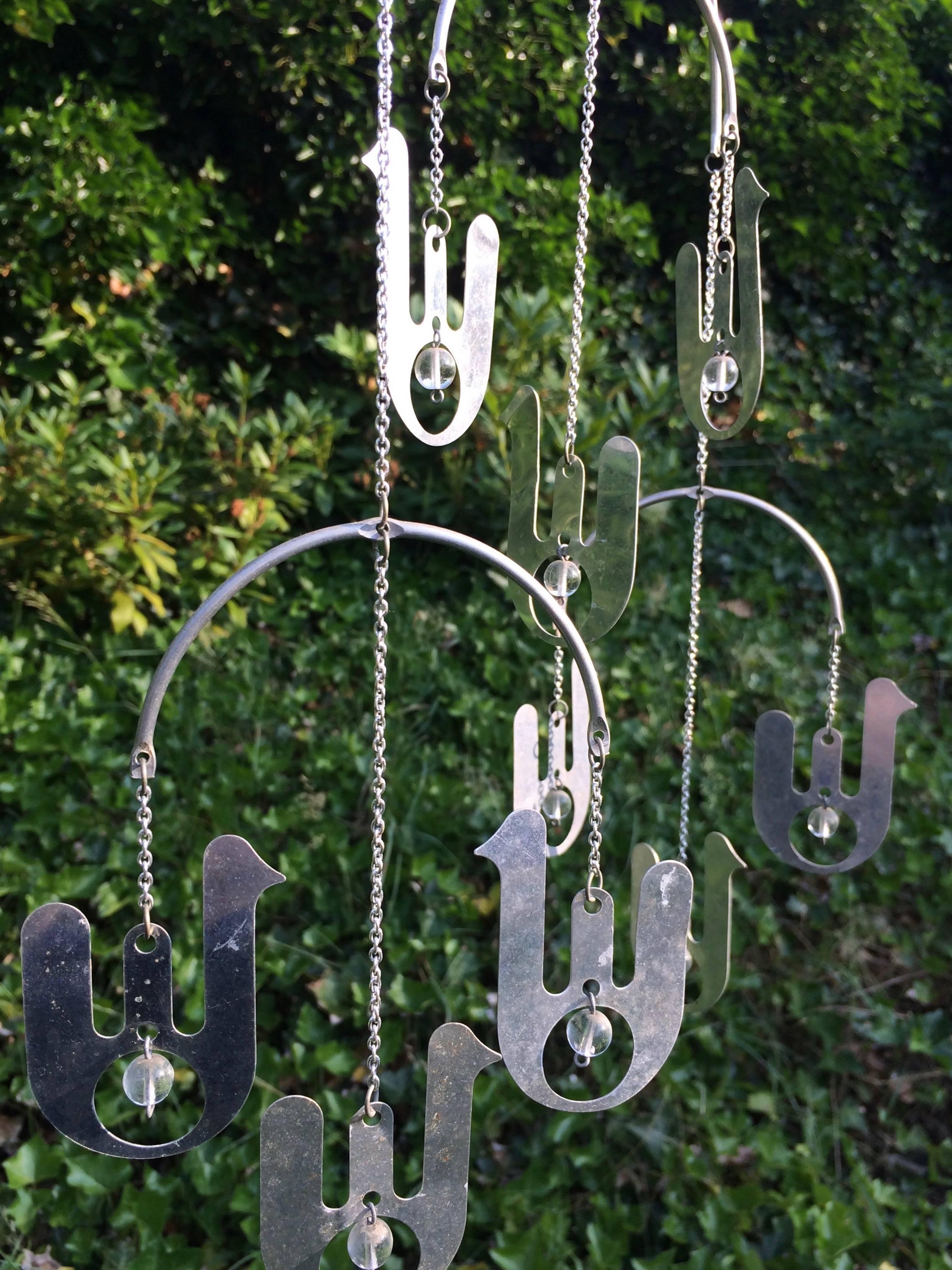 Abstract bird's on chains mobile in aluminum with transparent beads made by Raija Aarikka, Finland during the 1970s.