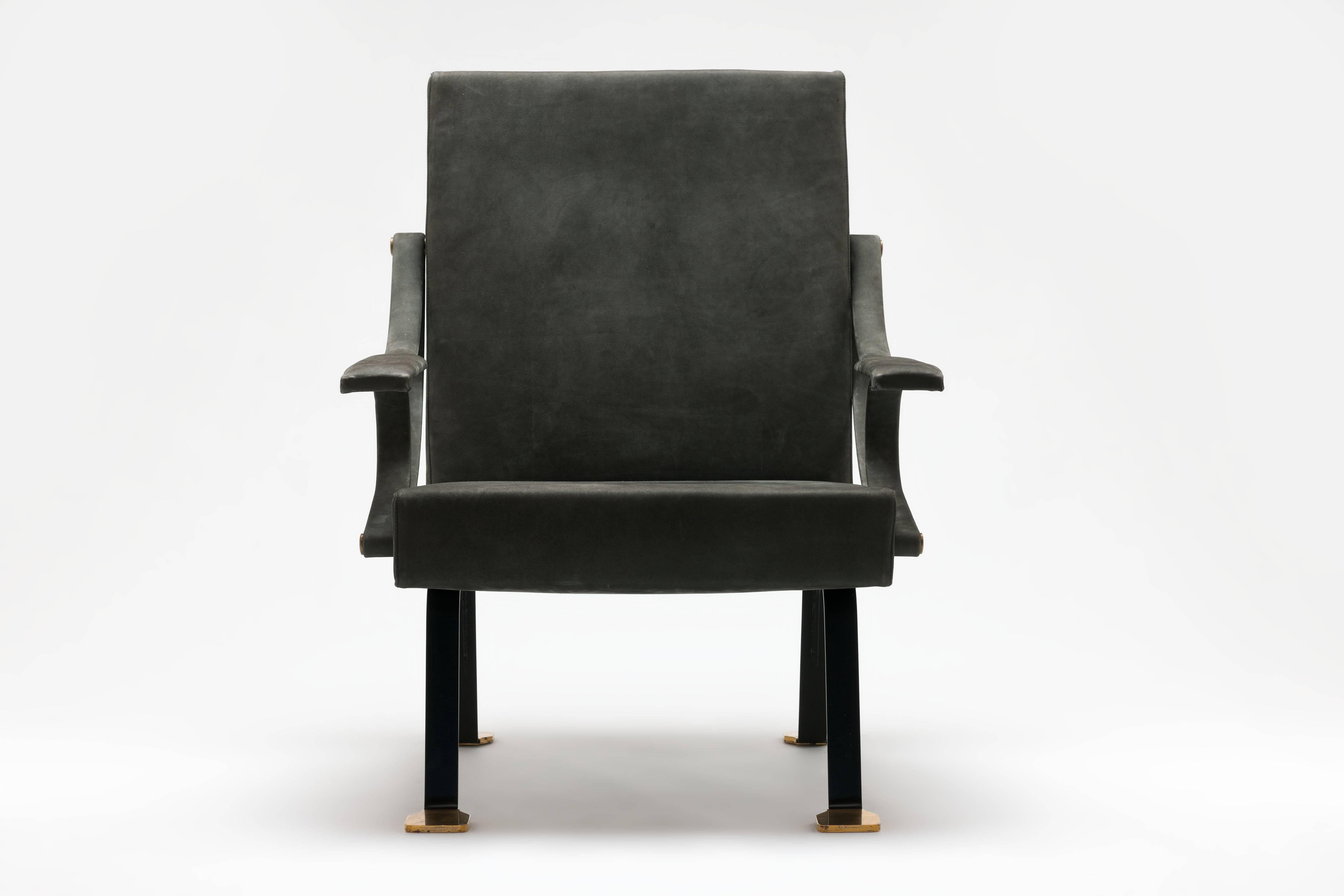 Three positions recliner armchair by Italian designer Ignazio Gardella, model Digamma, with Iconic brass 'duck' feet executed in bespoke nubuck leather. 
Chair dates from first re-issue series production after Gavina and comes in wonderful condition