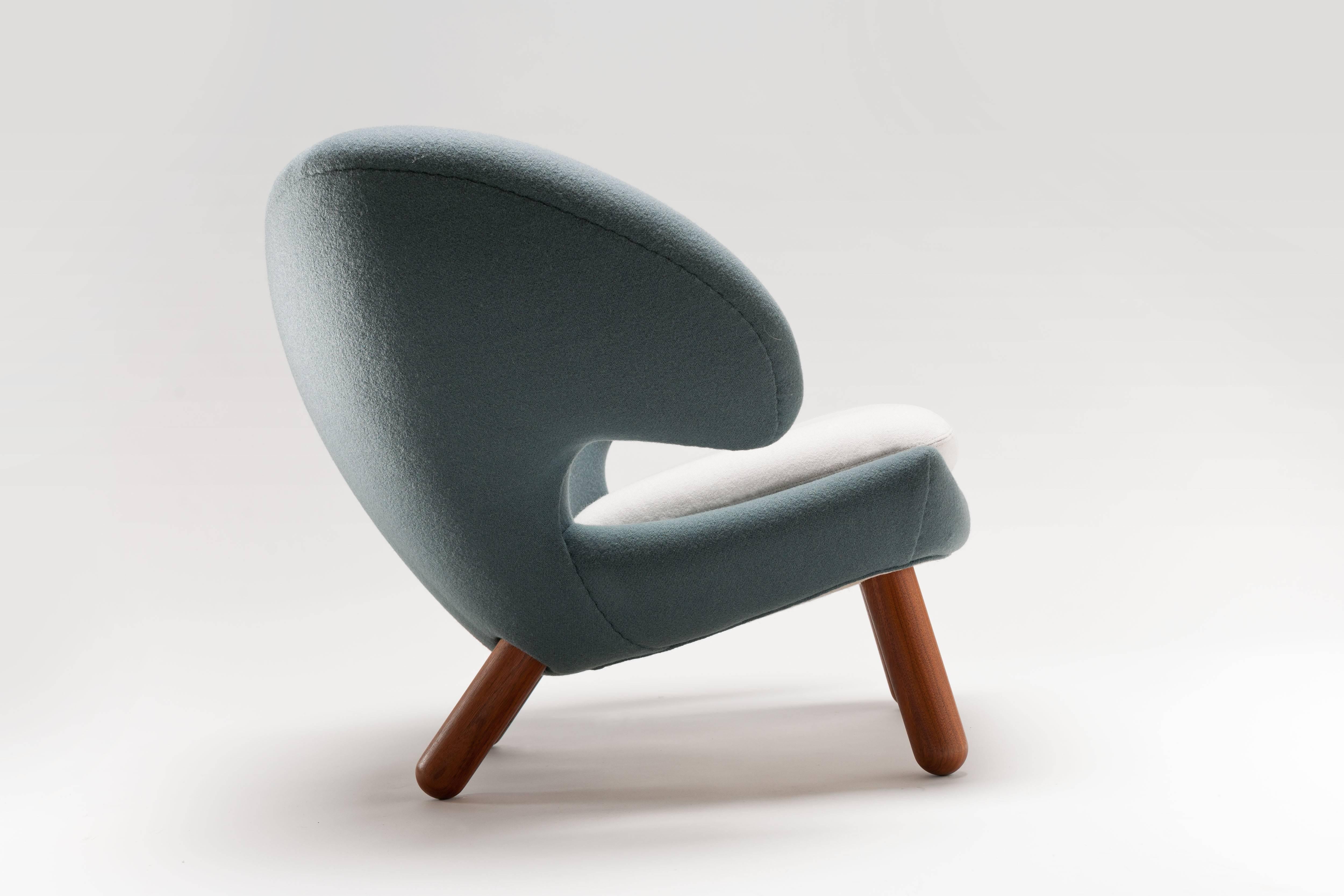 Hand-stitched upholstered Pelican chair by Danish designer Finn Juhl, originally designed in 1939 and made back then in very limited numbers, therefor not to be found vintage.
The chair is upholstery in a fabric by Kvadrat and comes with solid