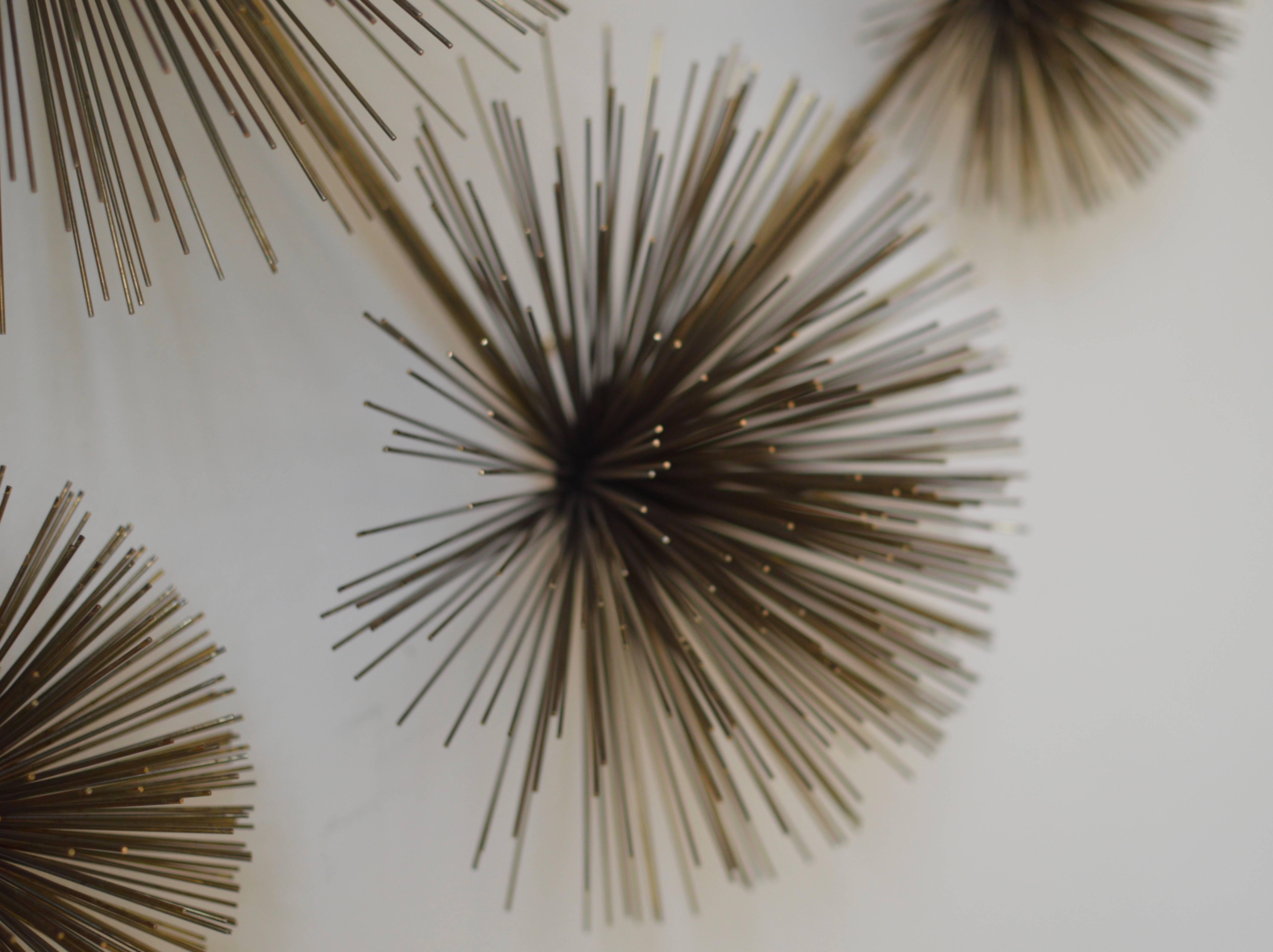 Metal 'Pom Pom' or 'Sea Urchin' wall sculpture executed in brass, fully signed and dated, 'C Jere 1979' in wonderful original vintage condition.
Sculpture can hang by one to three hooks in horizontal or vertical.