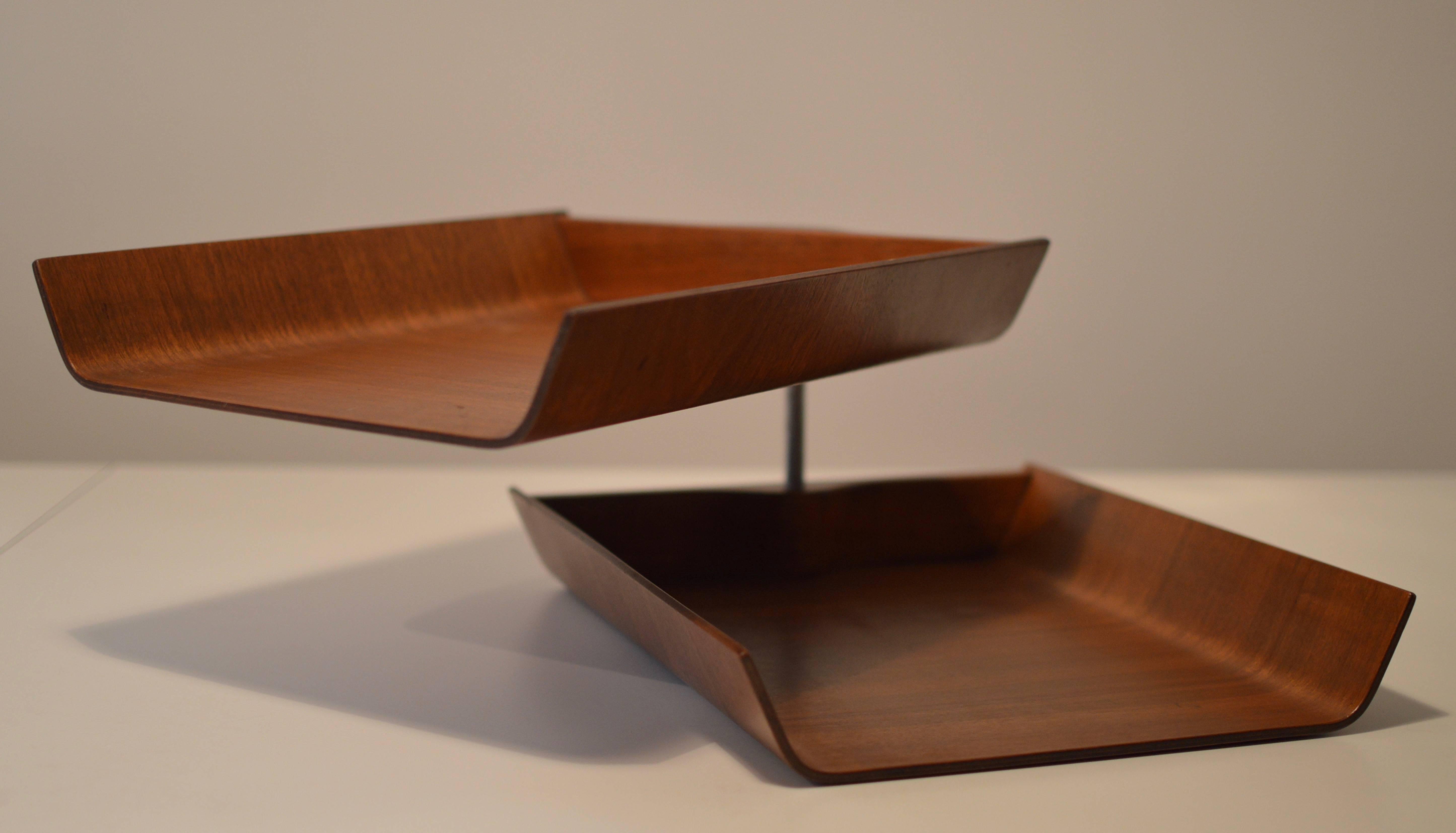 Iconic sculptural and functional desk accessory by Florence Knoll executed in walnut plywood. The upper tray pivots.
Signed with manufacturer's label to underside.

Worldwide standard parcel shipping is complimentary.
 