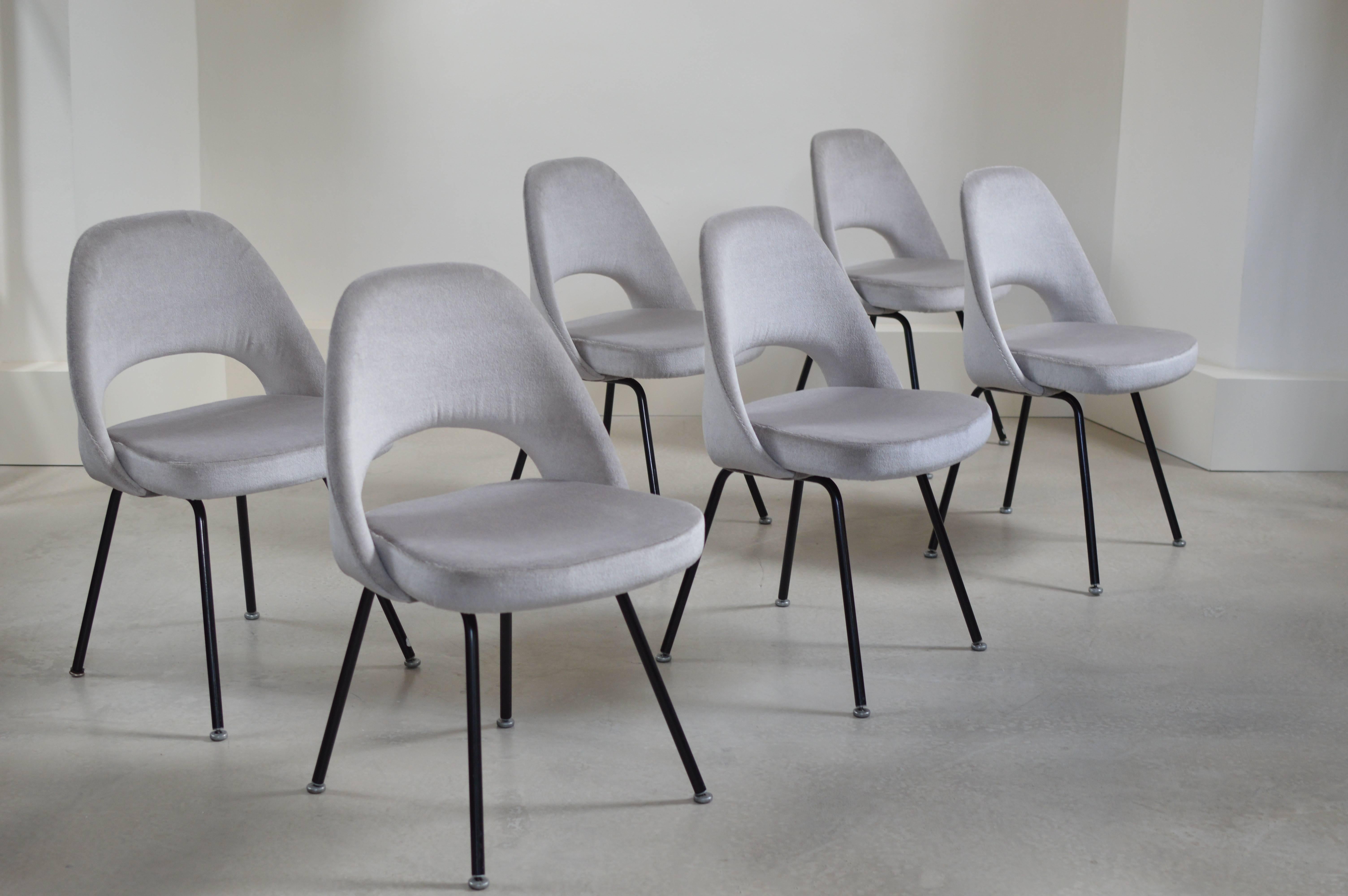 Set of six (6) model 71 series chairs by Eero Saarinen for Knoll International. Chairs date from early 1950s production series and have been completely restored and reupholstered in a gorgeous grey mohair and silk fabric. 

