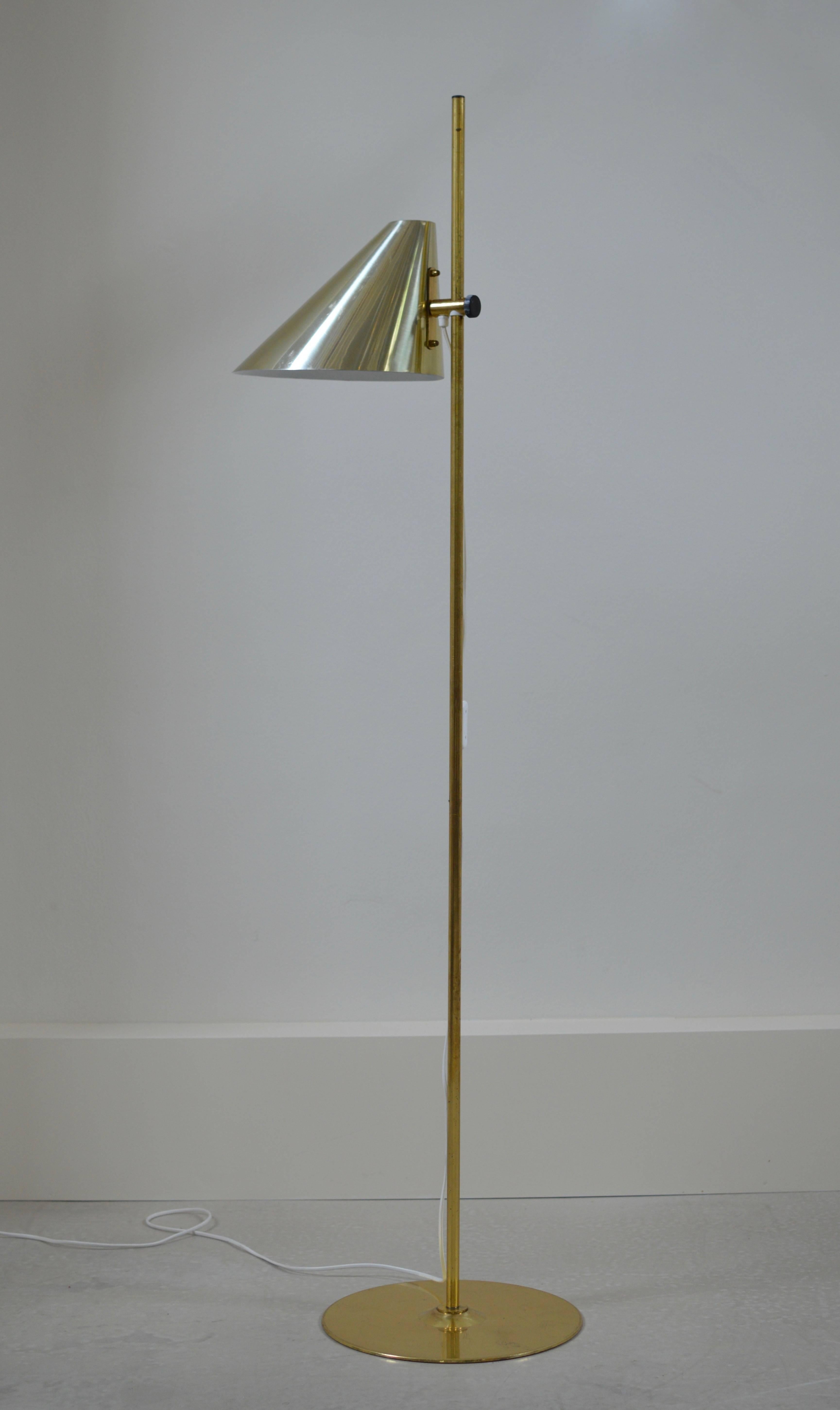 Brass floor lamp with asymmetrical cone shaped shade by Hans-Agne Jakobsson for Markaryd, Sweden. 
Shade is manually height adjustable and comes with original manufacture label.

Lamp is executed with original wiring which works very well, we can