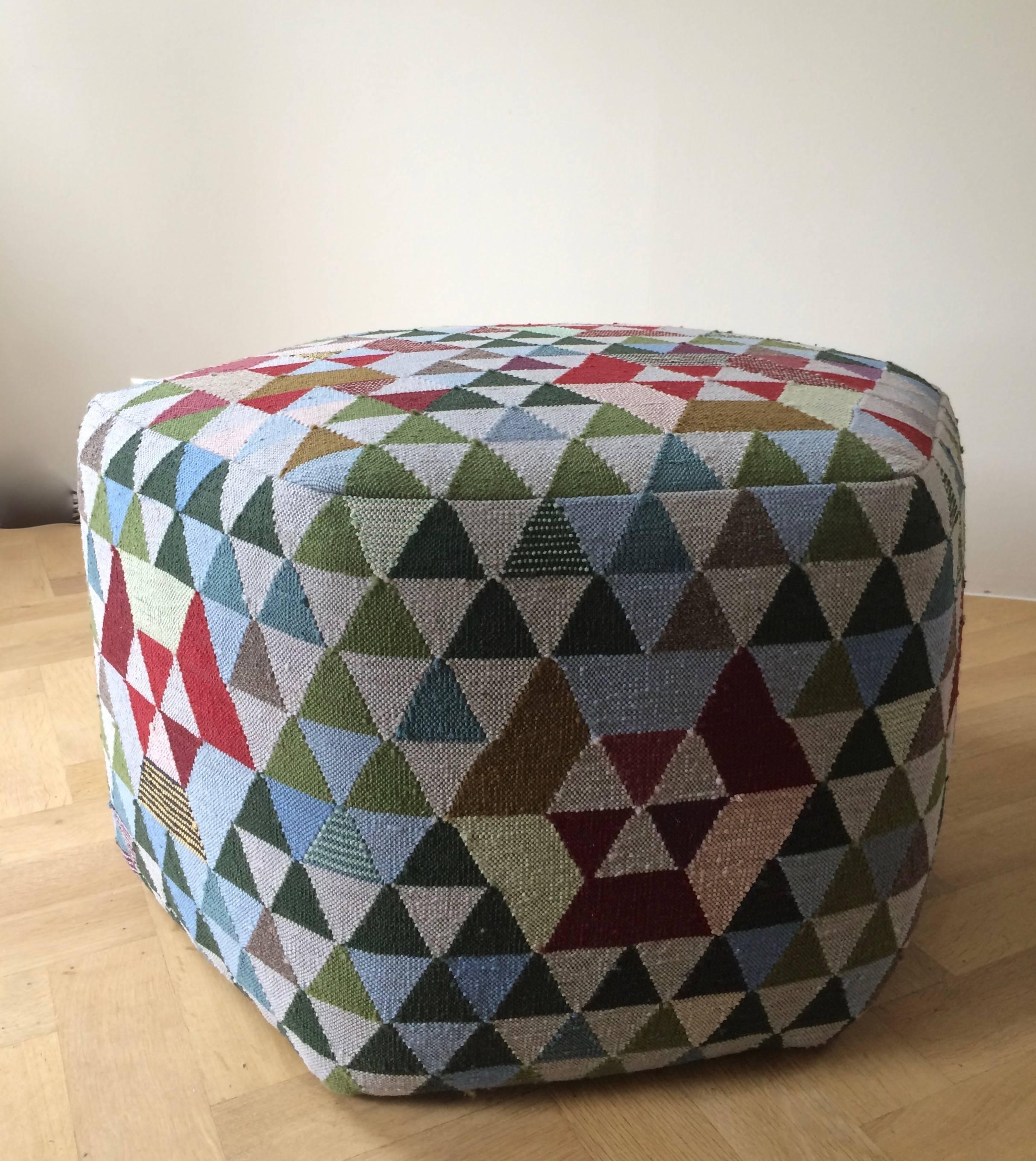 'Triangles' Pouf by Dutch Designer Bertjan Pot, designed for the legendary rug company Golran. 
The pouf is executed from a modern Kelim technique in a bright color palette of precious materials as fine wools, silk, and cactus fibers and is a