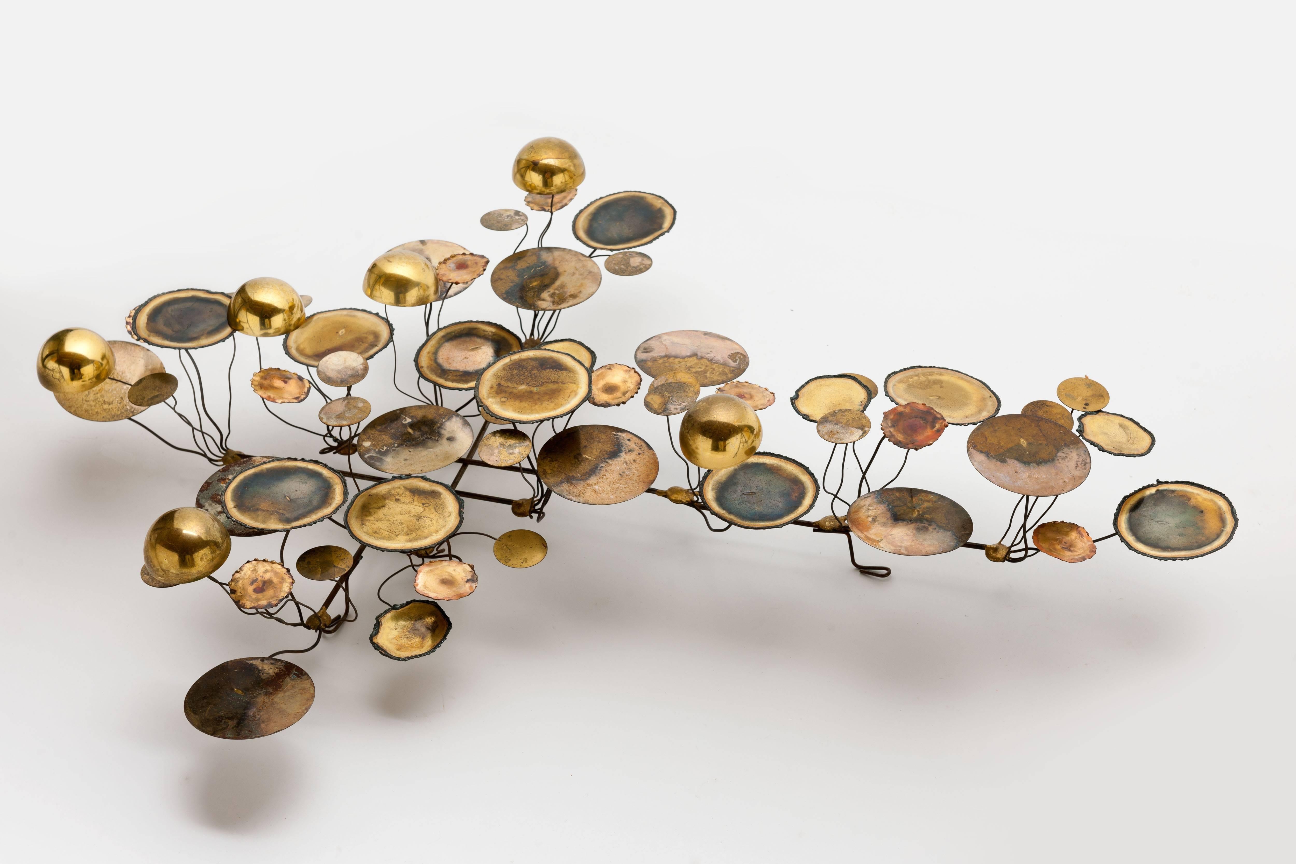 Iconic 'Raindrops' wall sculpture by Artisan House from late 1960s by Curtis Freiler & Jerry Fels.
Edited rough and polished brass and steel.

Amazing decorative piece with unique patine from age.