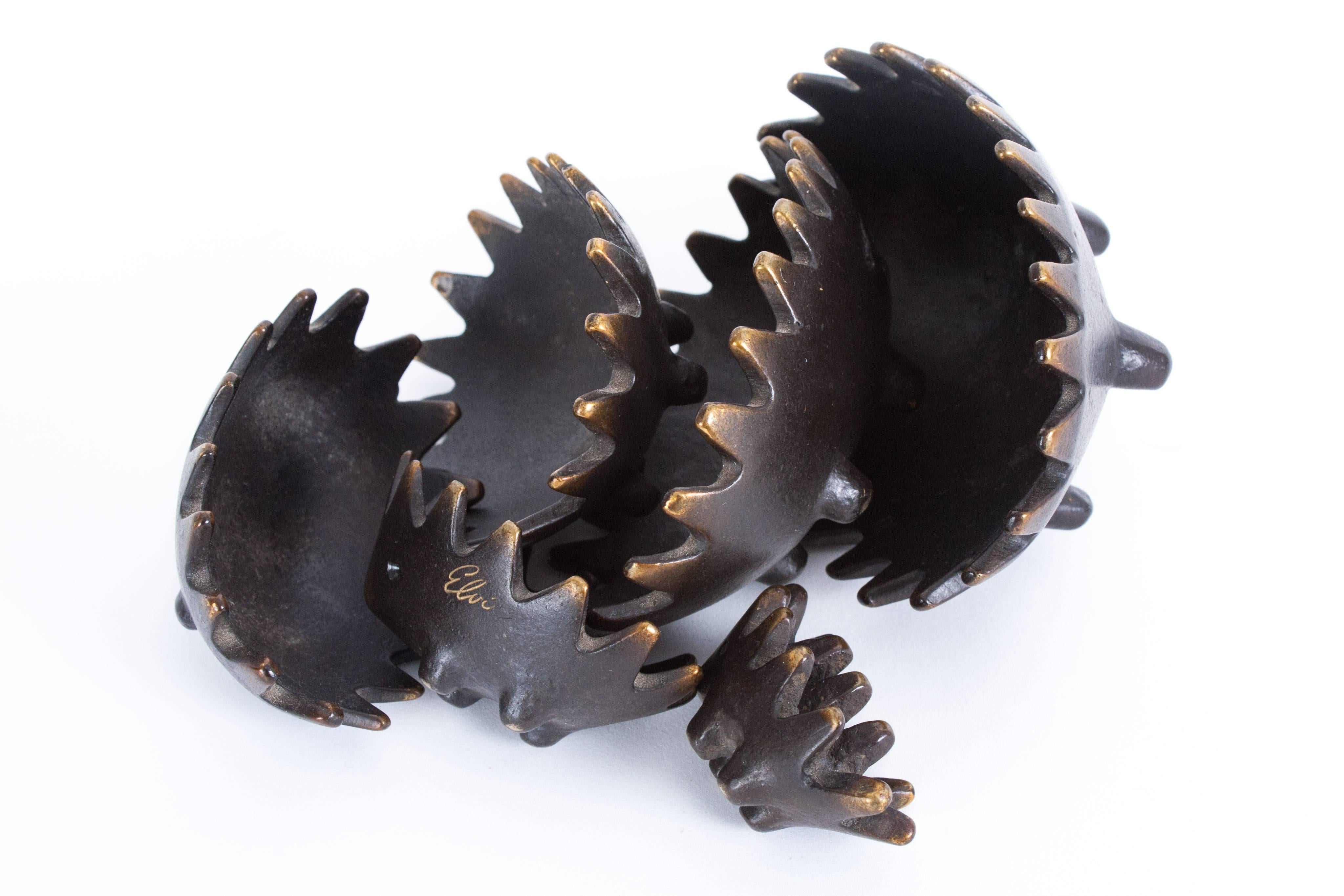 Hedgehog with her kids in bronze. The mother and kids has a very nice patina. Many years petted by hands. It is a havy set and nice to play with. The little did is very strong and thick. Originally made as a set of ashtrays! Signed with a name