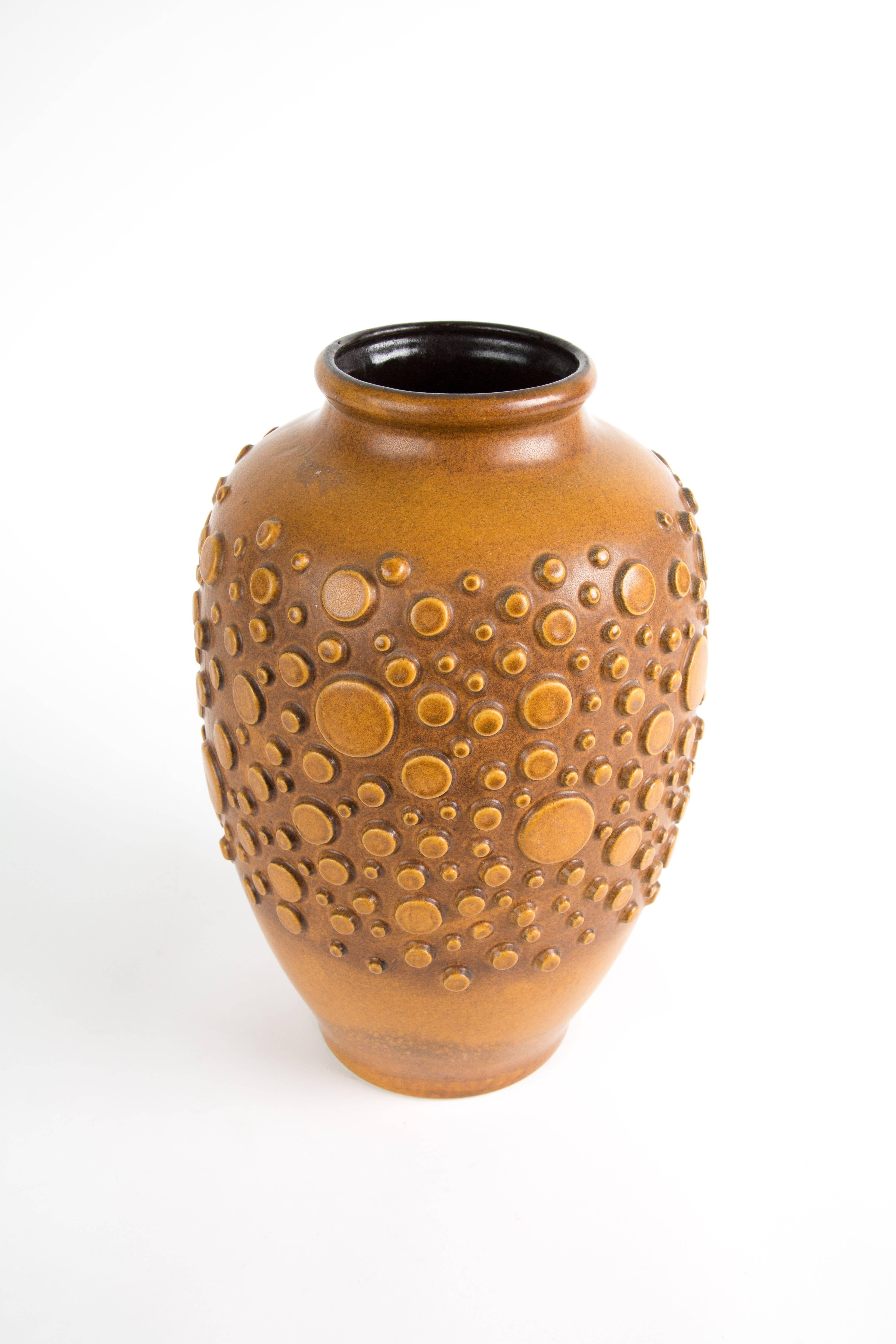 HUGE BRUTALIST  polka dot vase. Powerful formed vase. The color of the polka dots are in nice contrast with the back brown color.