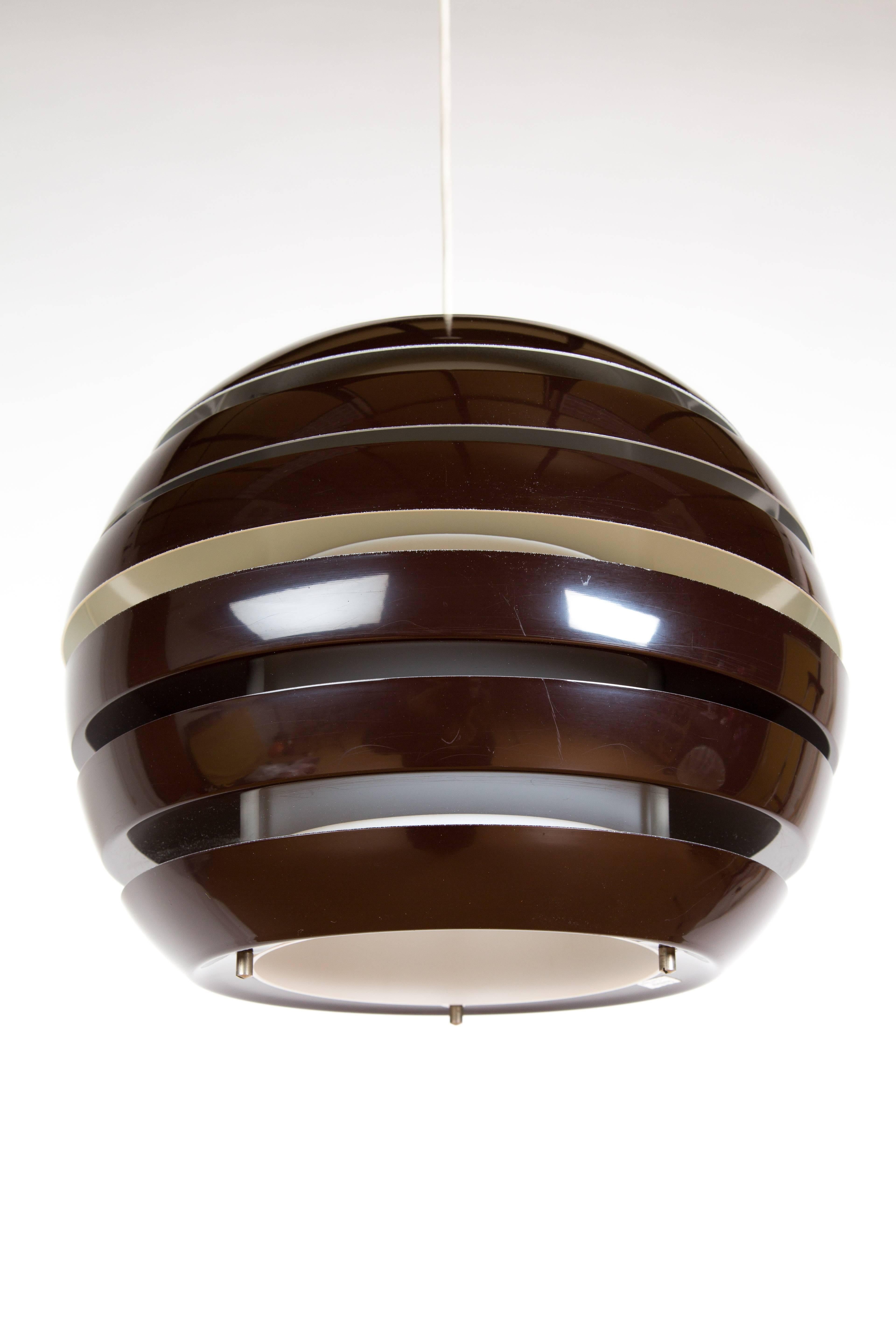 HANGING LAMP LE MONDE . Brown metal lamp designed by Carl Thore for Granhaga in Sweden. The outsite is of metal and the centre is of illuminating plastic.