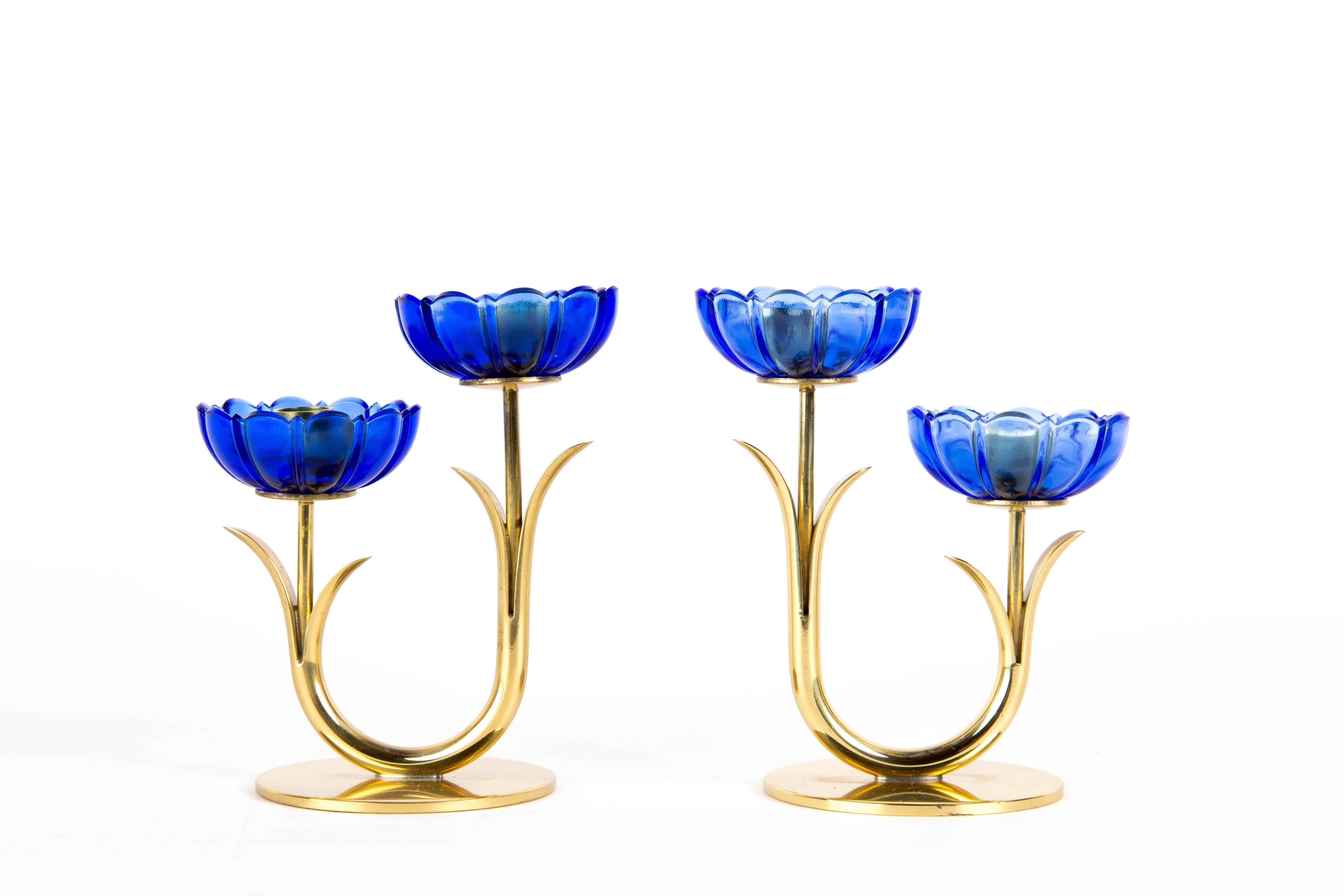 GUNNAR ANDER CANDLE HOLDER. A set of two double candle holders with blue transparent art glass. Designed by Gunnar Ander for Swedish Ystad-Metal. The set is marked on the bottom. The price is for one set double flowers (four flowers). There are two