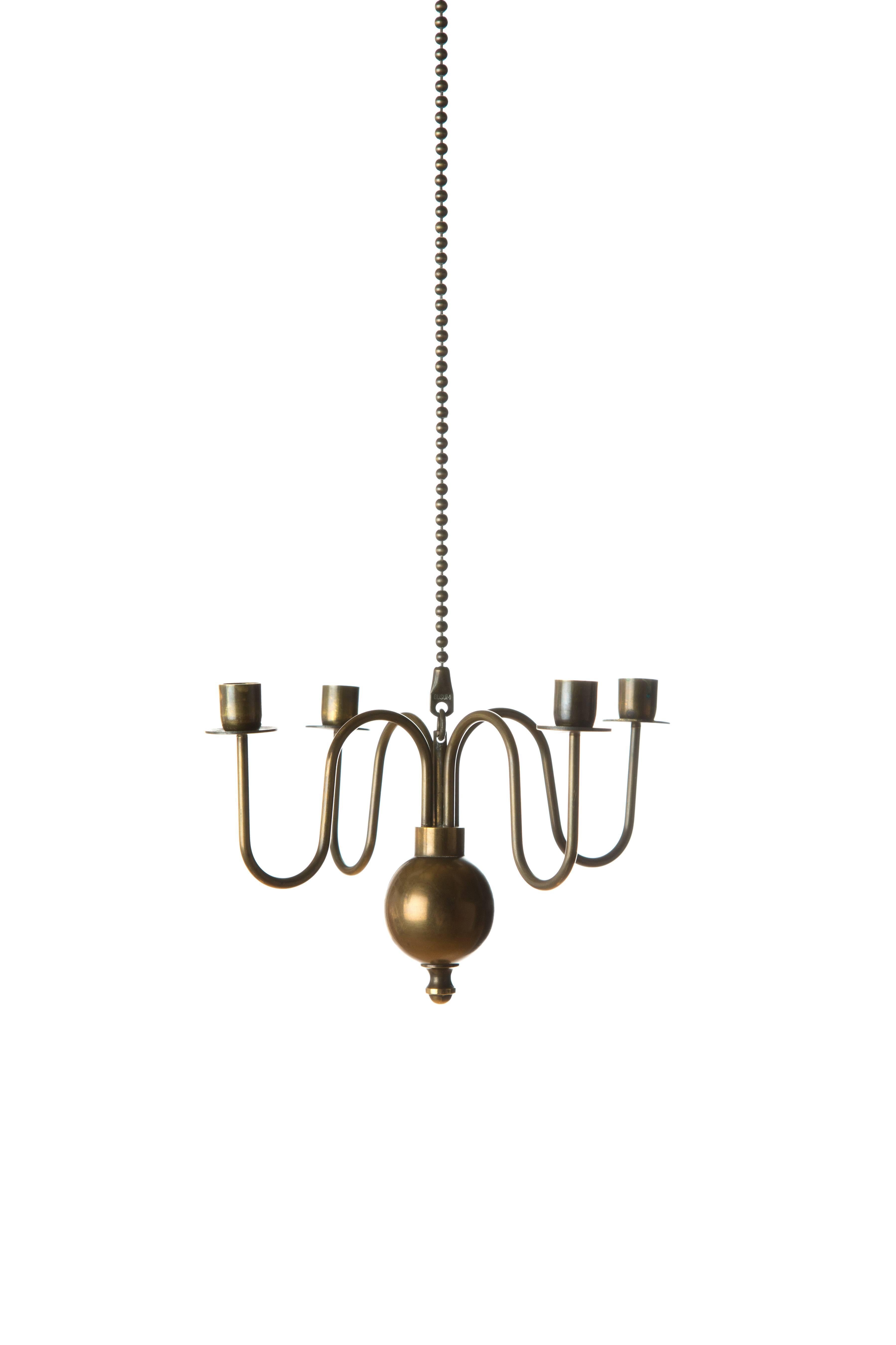 A copper candle pendant designed by Gunnar Ander for Ystad Metal Gusum. Elegant by form and material. Haevy ball and long cable. Measure: The total length is 80cm. Signed with Gusum.