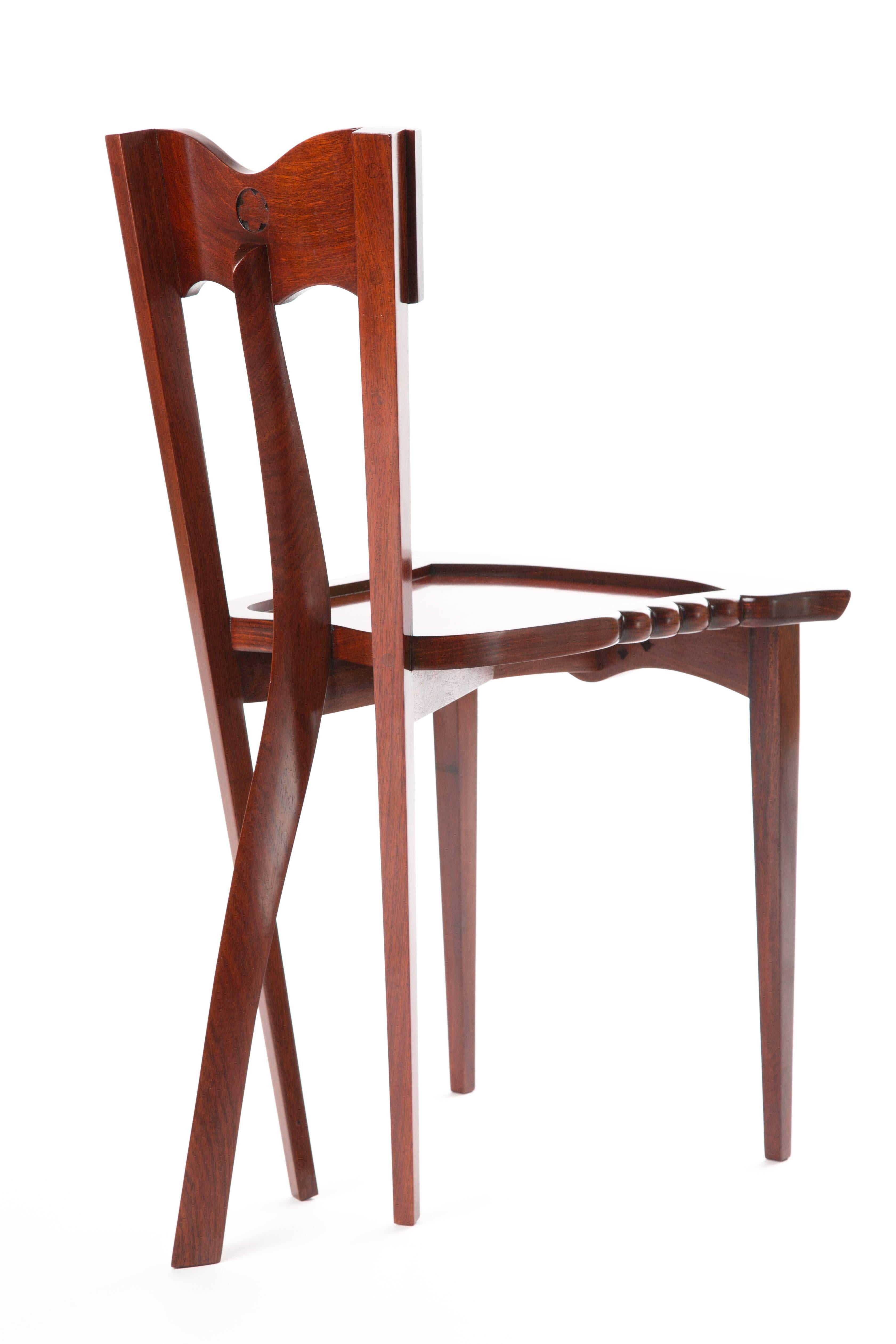 YOOCHAI CHAIR.  Teak wood chair with hand-carved elements and mother-of-pearl details. Al Yoochai chairs are handmade. This chair has five legs. The form is romantic and organic. Modern-Barok.

Borek Sipek (1949-2016) was an Czech architect, but he