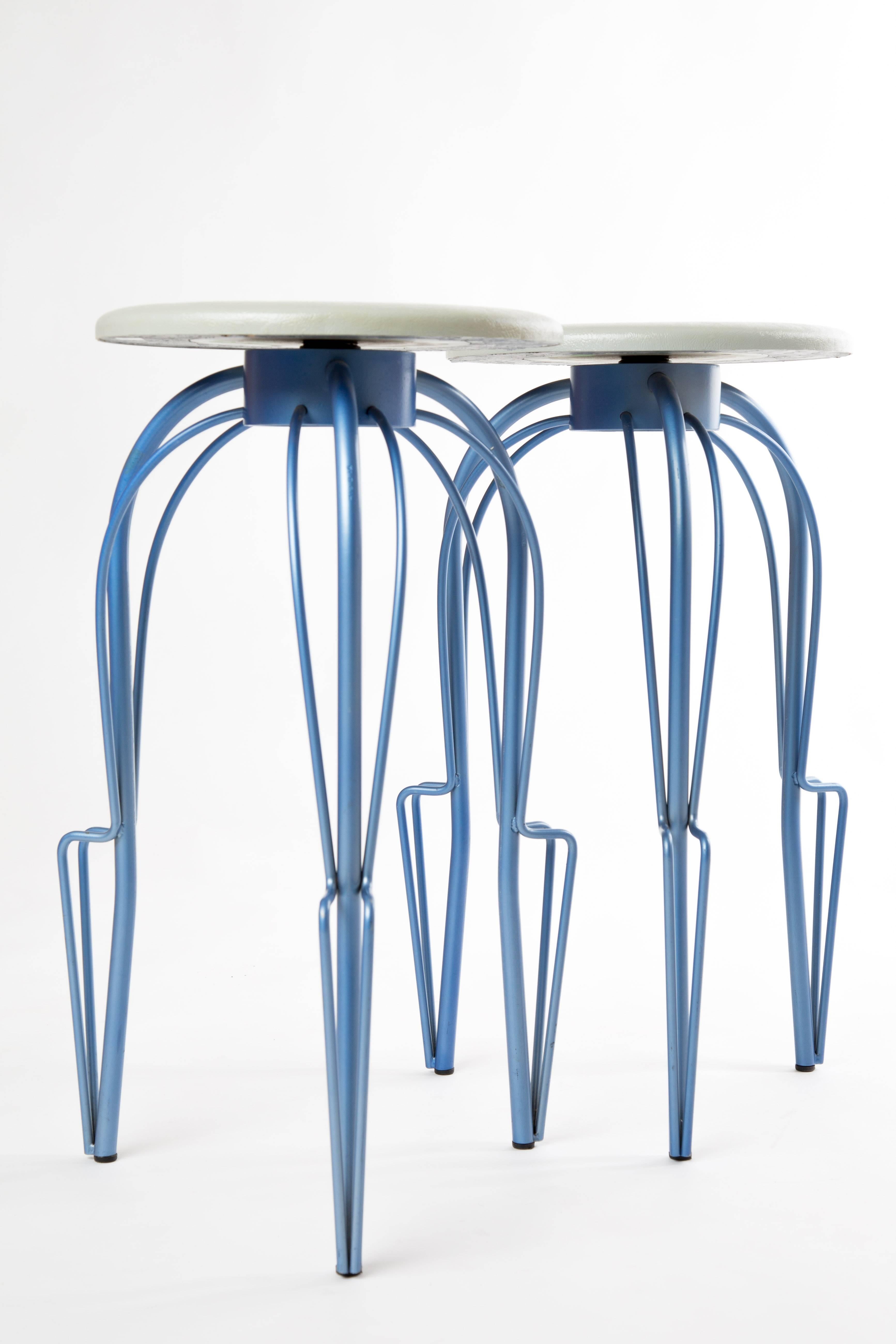Borek Sipek Savarin bar chairs. Two bar chairs designed in 2001 by Borek Sipek. He designed the seating with a joke. The seating looks like a padded seating, but without buttons. The chairs are made by Sipeks own company 