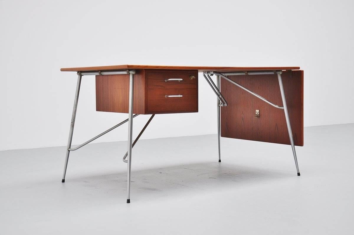 Fantastic drop-leaf desk by Børge Mogensen for Søborg Møbelfabrik, Denmark, 1950. This amazing desk has a nickel-plated spike base, is fully foldable and has a drop leaf shelve on the right. Super dynamic shaped desk in good condition for its age,