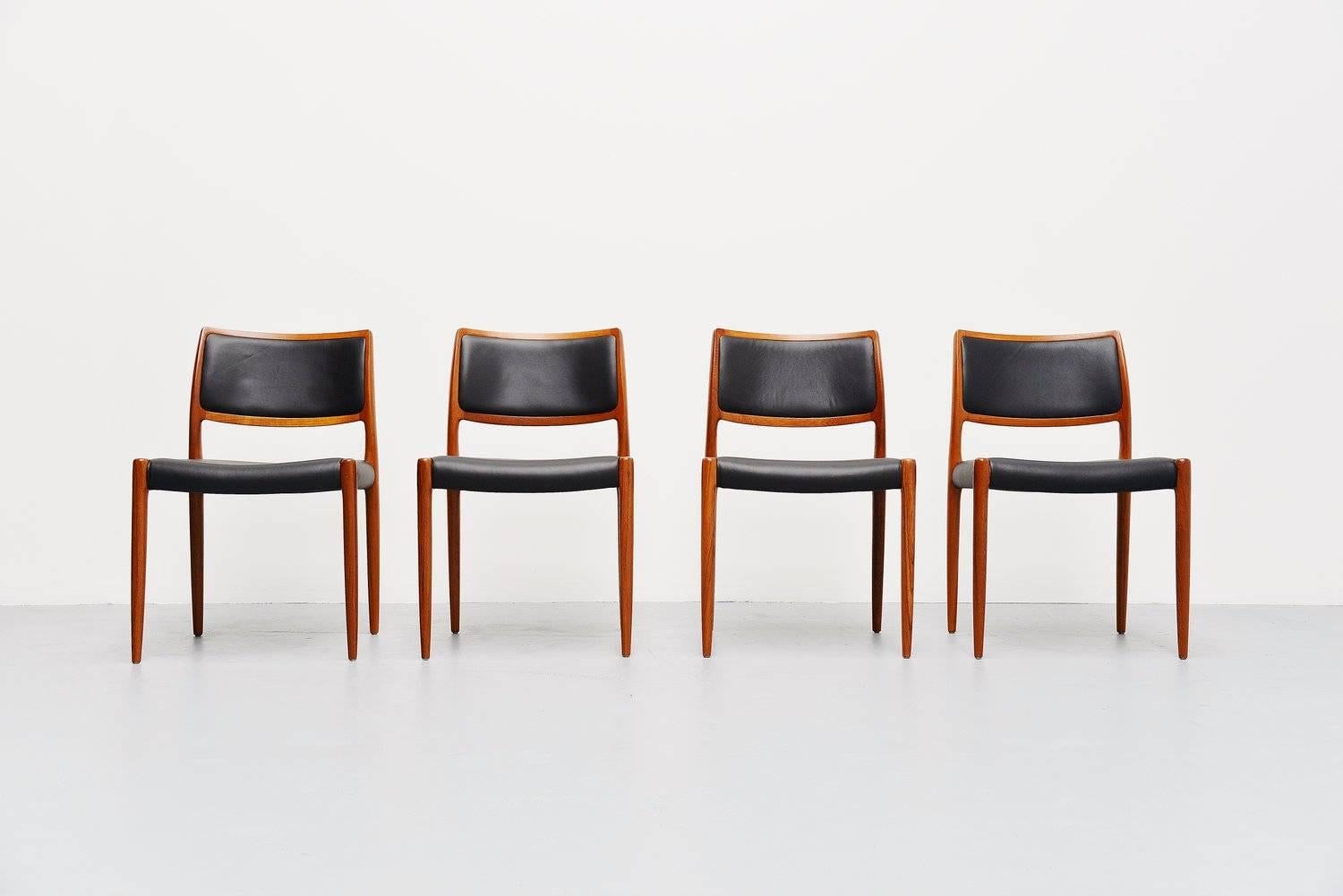 Set of four dining chairs model 80 designed by Niels Møller for J.L Møllers Møbelfabrik, Denmark 1968. These chairs are made of solid teak which was fully refinished and they are newly upholstered in black leather in supreme quality leather by