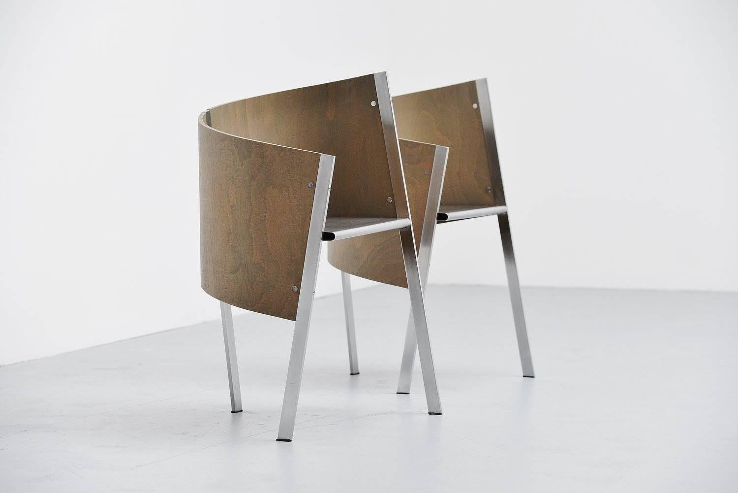 Stunning pair of side chairs designed by Paolo Pallucco for Gambe-Pallucco, Italy, 1987. These chairs have a brushed steel structure and grey stained plywood backrest, existing in two parts. These chairs are in very good original condition and would