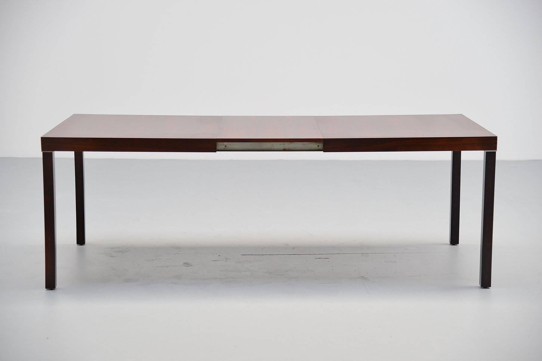 Very nice extendable dining table designed by Inger Klingenberg for Fristho Franeker, Holland, 1960. This rosewood dining table has some very nice details, on the corners you will find some dovetail connections and a metal square tag to finish the