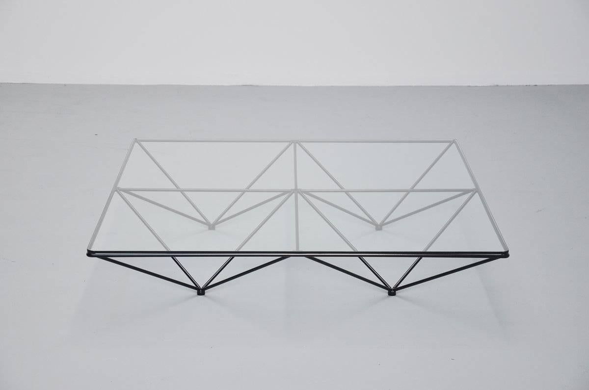 Spectacular modernist coffee table designed by Paolo Piva for B&B Italia, Italy 1982. Solid metal frame black lacquered, connected like a spider web. Supports a glass-top made of high quality hardened glass. Sophisticated table modern shaped and
