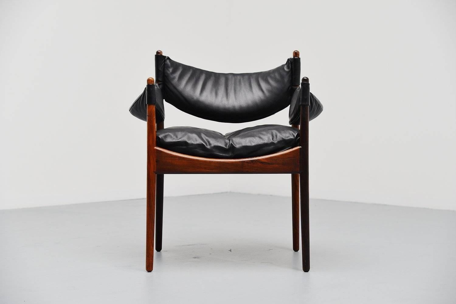 Very nice armchair designed by Kristian Solmer Vedel for Søren Willadsen, Denmark, 1963. This nice sculpted rosewood armchair has a solid rosewood frame and black leather seat. The chair is in original condition and looks great. Very comfortable