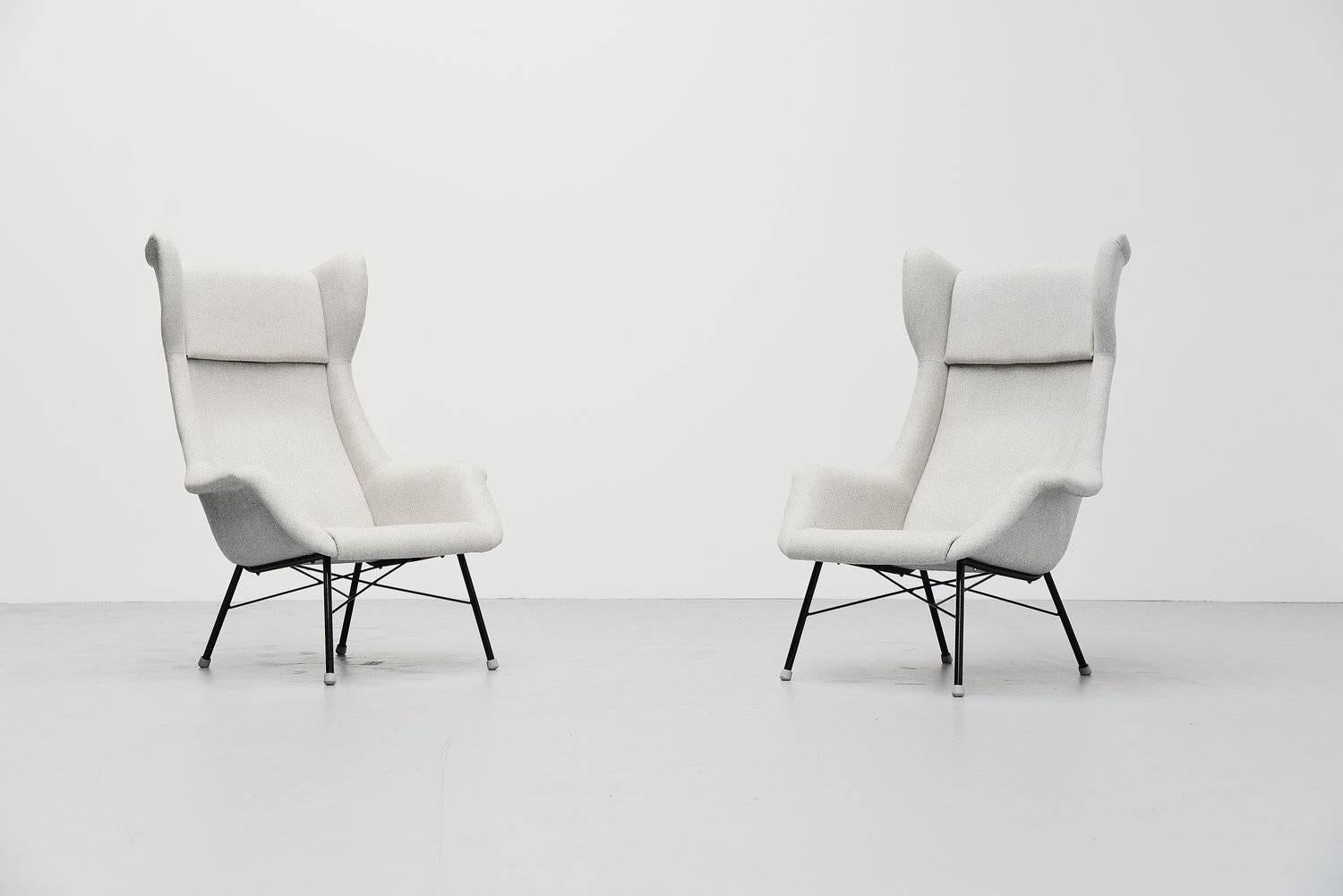 Fantastic pair of wingback lounge chairs designed by Miroslav Navratil, produced in own atelier in Czech Republic 1950. These chairs are like a mix of the Bovenkamp wingback chairs by Aksel Bender Madsen and the chairs by Augusto Bozzi for Saporiti.