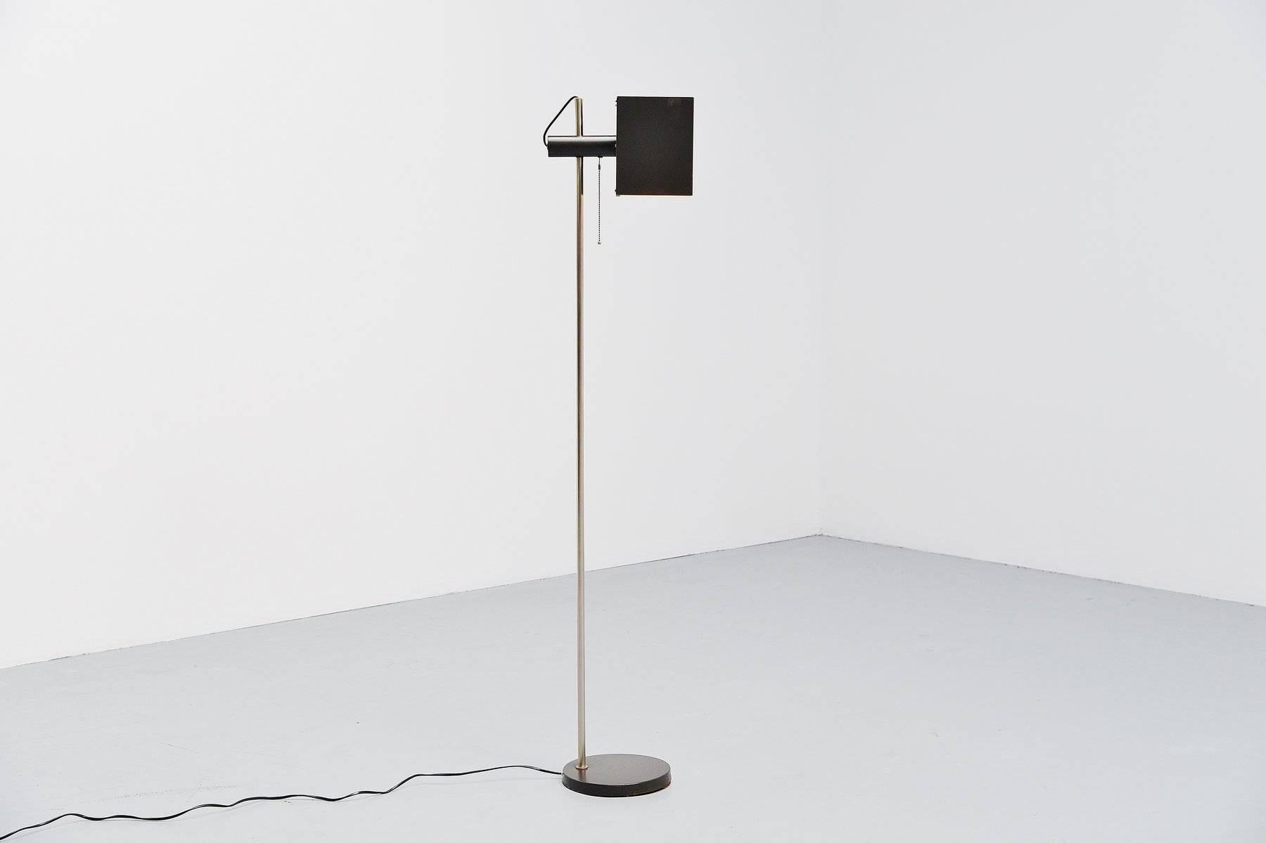 Very nice probably Italian or Danish floor lamp with cubic shade, rotates so easy to use as a reading lamp. The lamp has a very nice dark grey color, looks black but its real dark grey. It has an on/off pull cord switch and the arm is made of