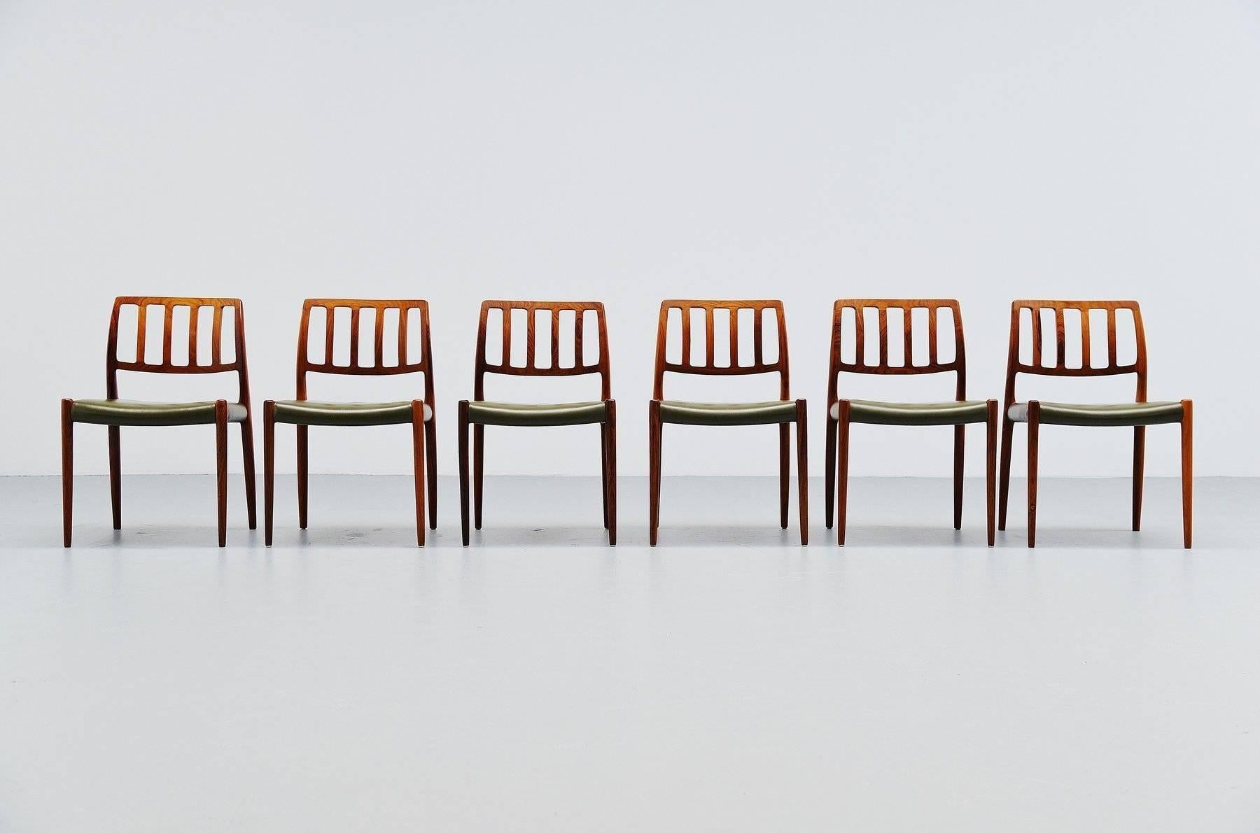 Very nice set of six rosewood dining chairs designed by Niels Otto Moller for J.L. Møller Mobelfabrik, Denmark, 1974. These chairs are made of solid rosewood which is ins very good pristine condition, the have original green leather upholstery also