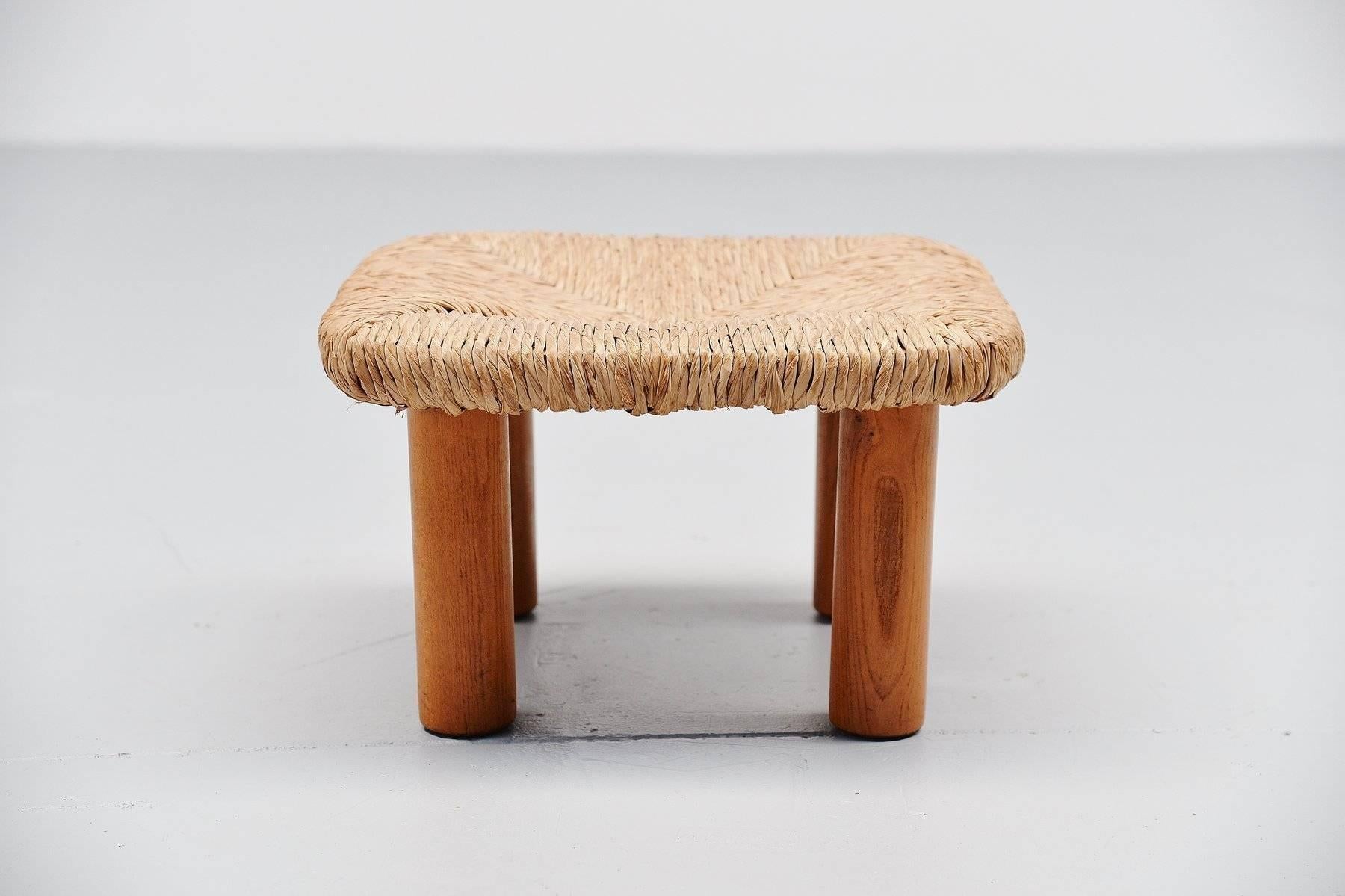 Very nice small stool designed and made by Wim Den Boon, Holland, 1950. This small stool has solid oak legs that can be disassembled from the metal structure frame. This stool is very similar to several designs by Charlotte Perriand. Very nice and