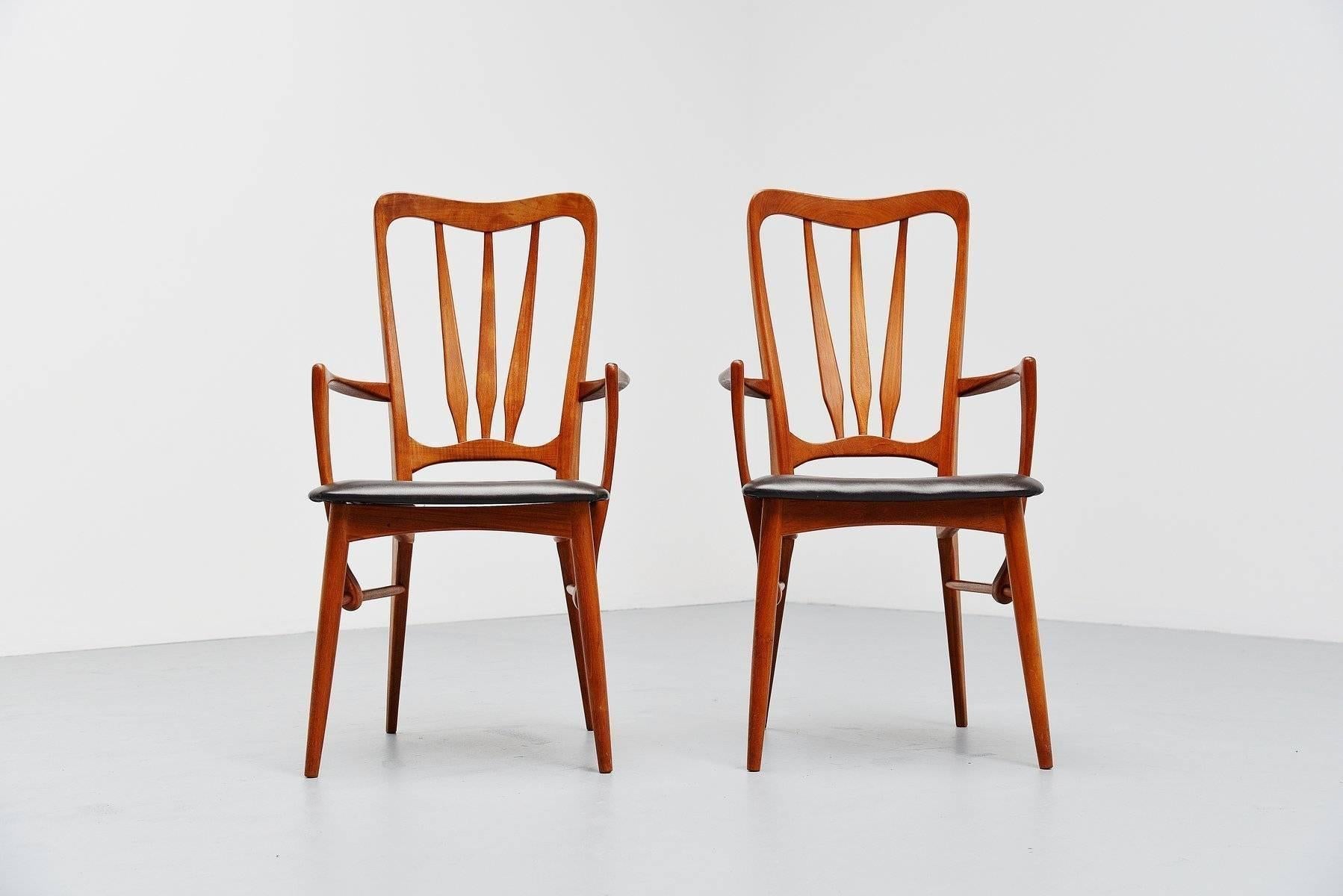 Very nice Ingrid armchair designed by Niels Kofoed for Hornslet Mobelfabrik, Denmark, 1960. These chairs have solid teak wooden frames and black leather upholstery. These chairs a very nice organic shaped and very well handcrafted. The chairs are in