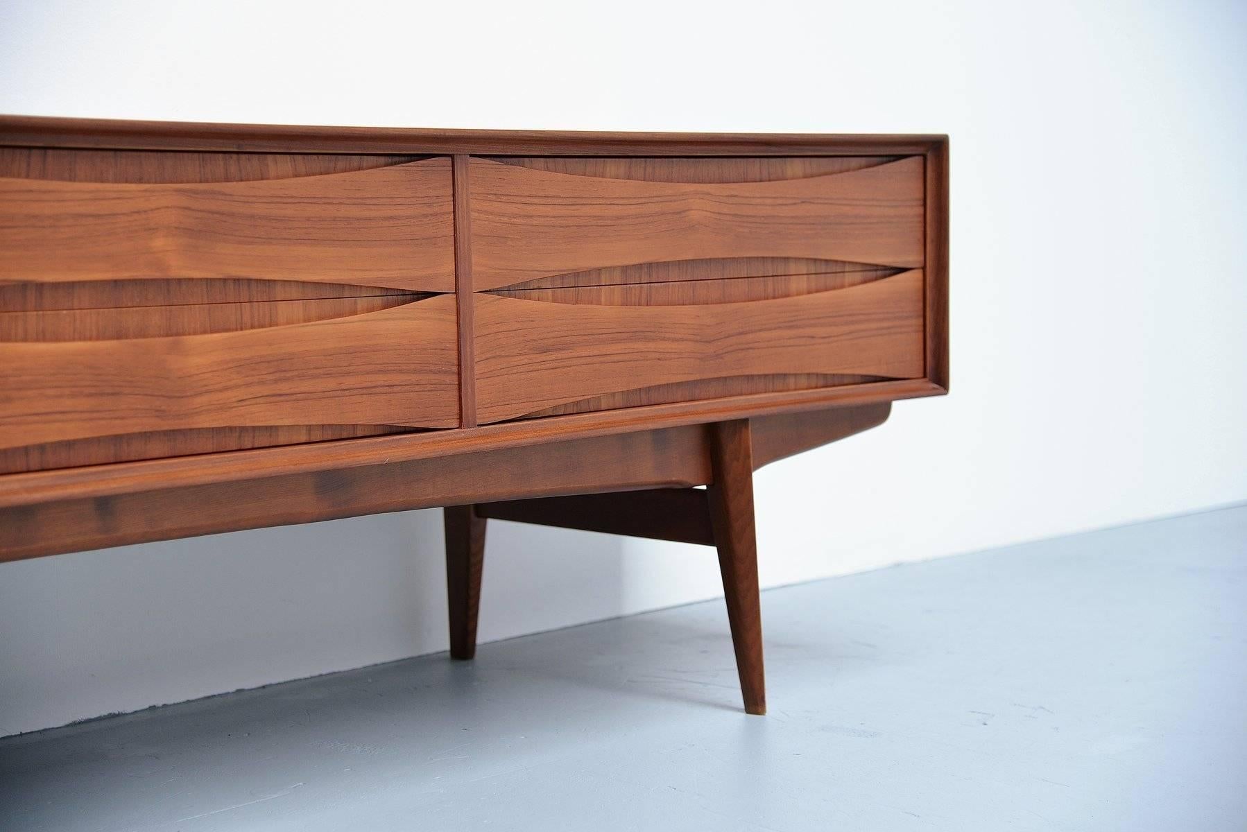 Very nice and quality low sideboard designed by Oswald Vermaercke for V-Form, Belgium, 1959. This amazing credenza has a very nice and warm teak color and is fully refinished into perfect condition. The designs by Oswald Vermaercke are visibly