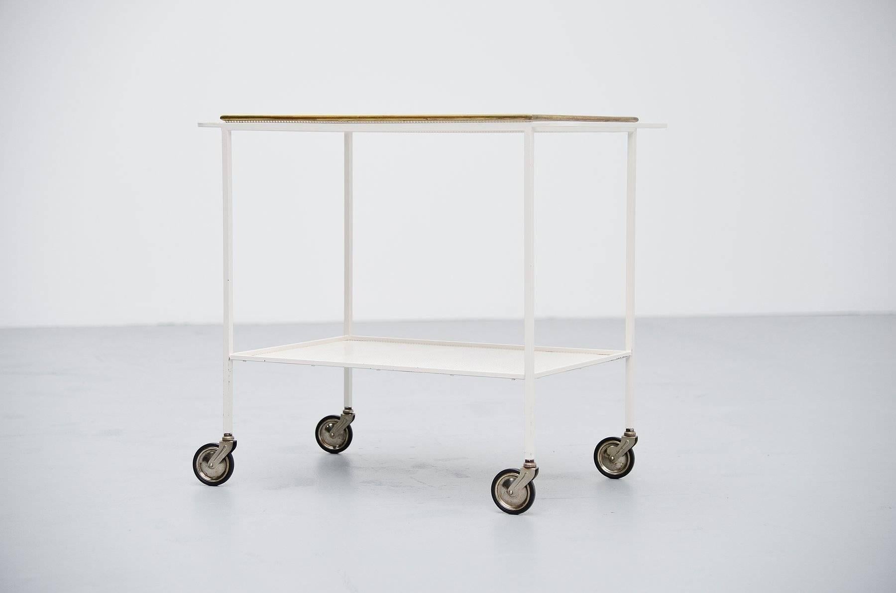 Modernist serving cart designed by Mathieu Mategot produced by Atelier Mategot, France, 1960. This serving cart is documented in the Mategot books so it’s a cart with references. This was made of whit lacquered metal and the serving tray has a brass