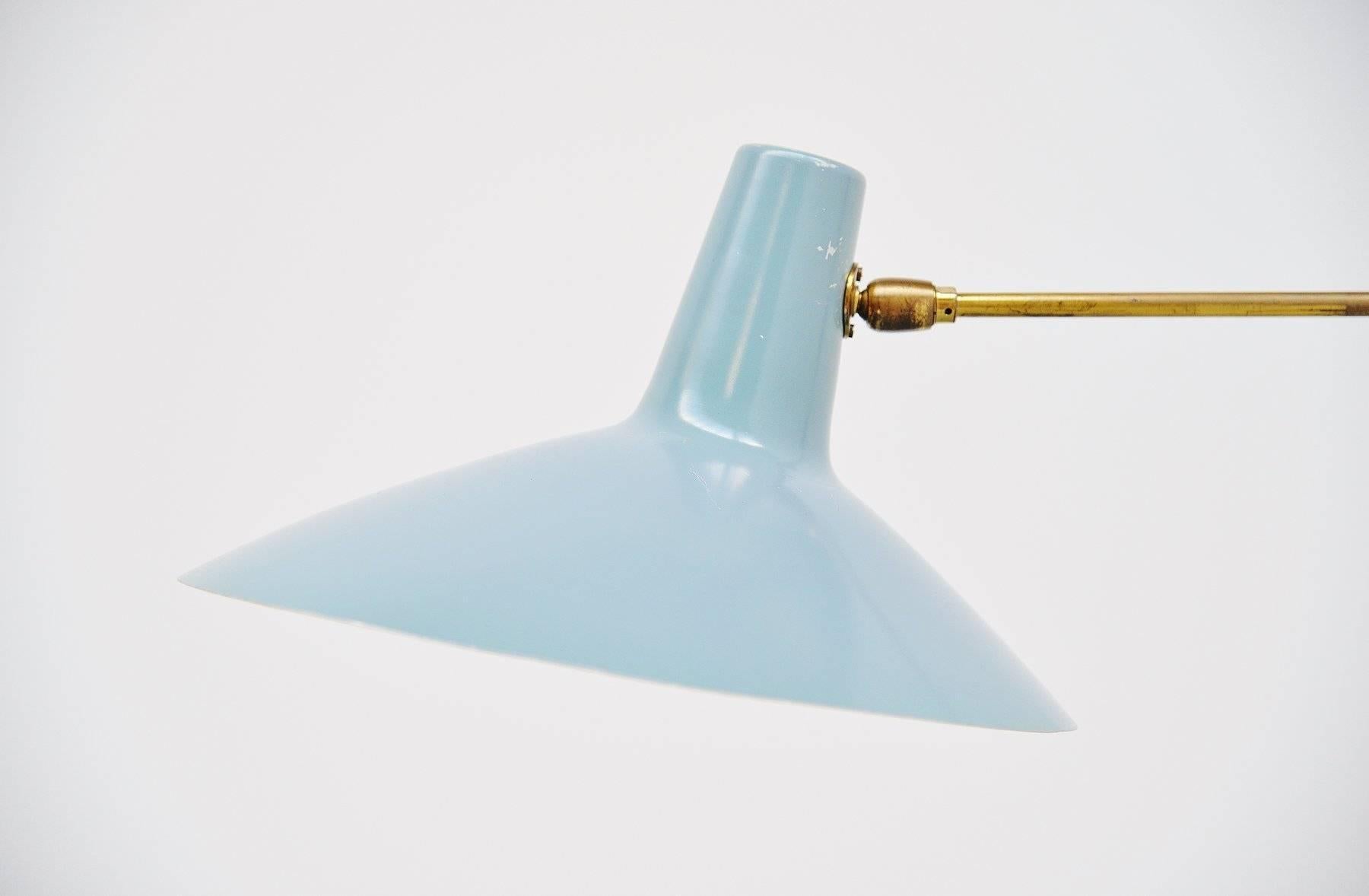 Very nice large swing arm wall lamp made and designed by Artimeta Soest, Holland 1960. This lamp has a nice Industrial blue color shade and wall plate, the arm is in brass. The lamp is very easy to wall hang and very functional as a reading lamp