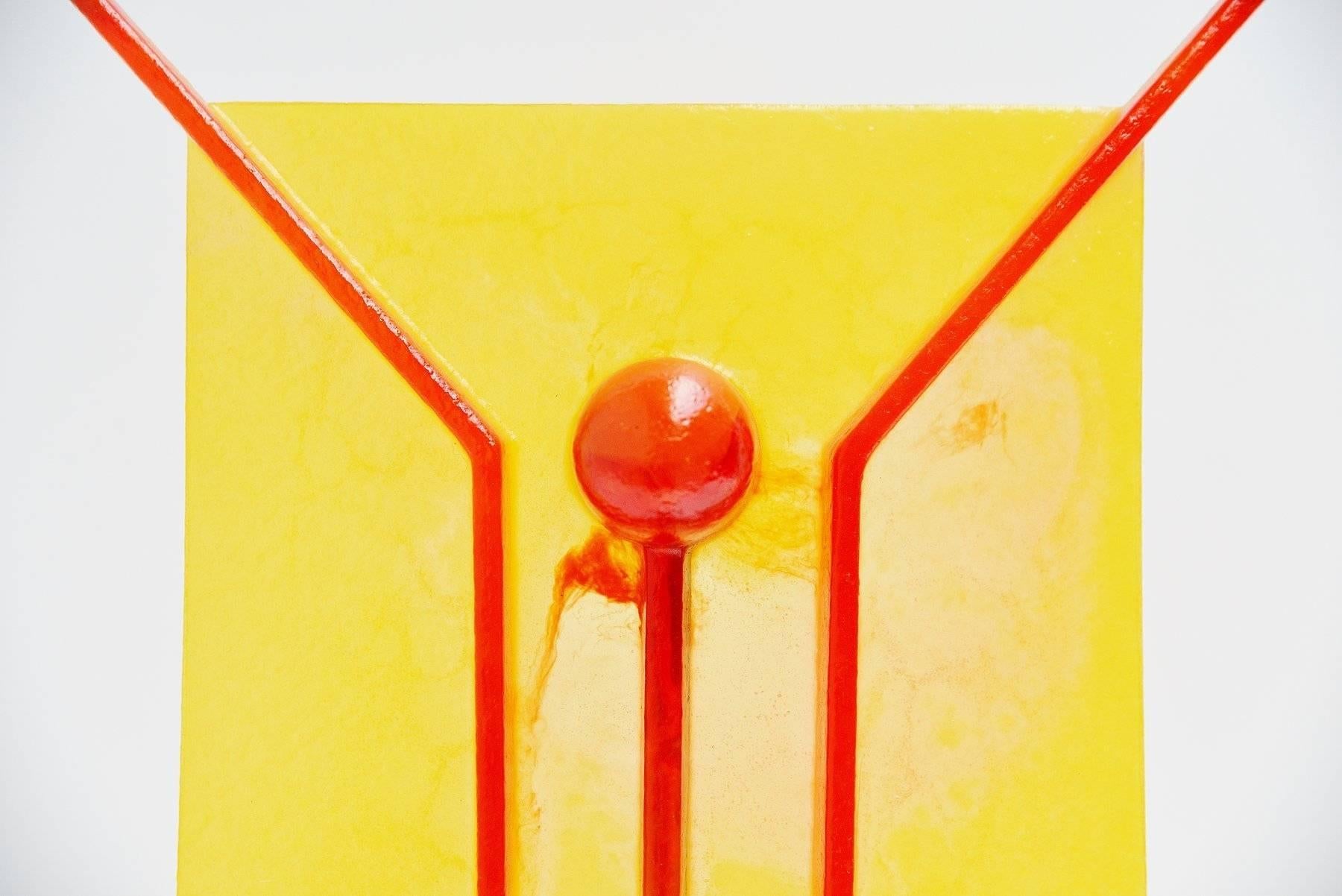 Funny table lamp designed by Gaetano Pesce for Open Sky, United States, 1999. This lamp was made of yellow and red resin and has a black metal support. The lamp uses up to 2 E14 bulbs up to 40 watt each. The lamp gives very nice and warm light when