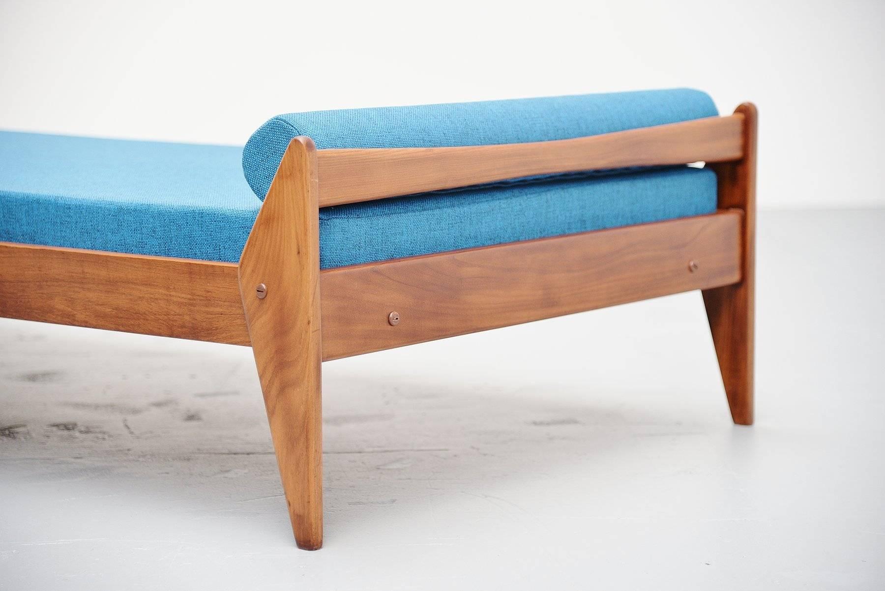 Very nicely shaped teak daybed made by Vamo Sonderborg, possible designed by Arne Wahl Iversen, Denmark, 1960. This bed is made of solid teak and we upholstered it with dark blue fabric which is a great contrast with the teakwood. Very nice and
