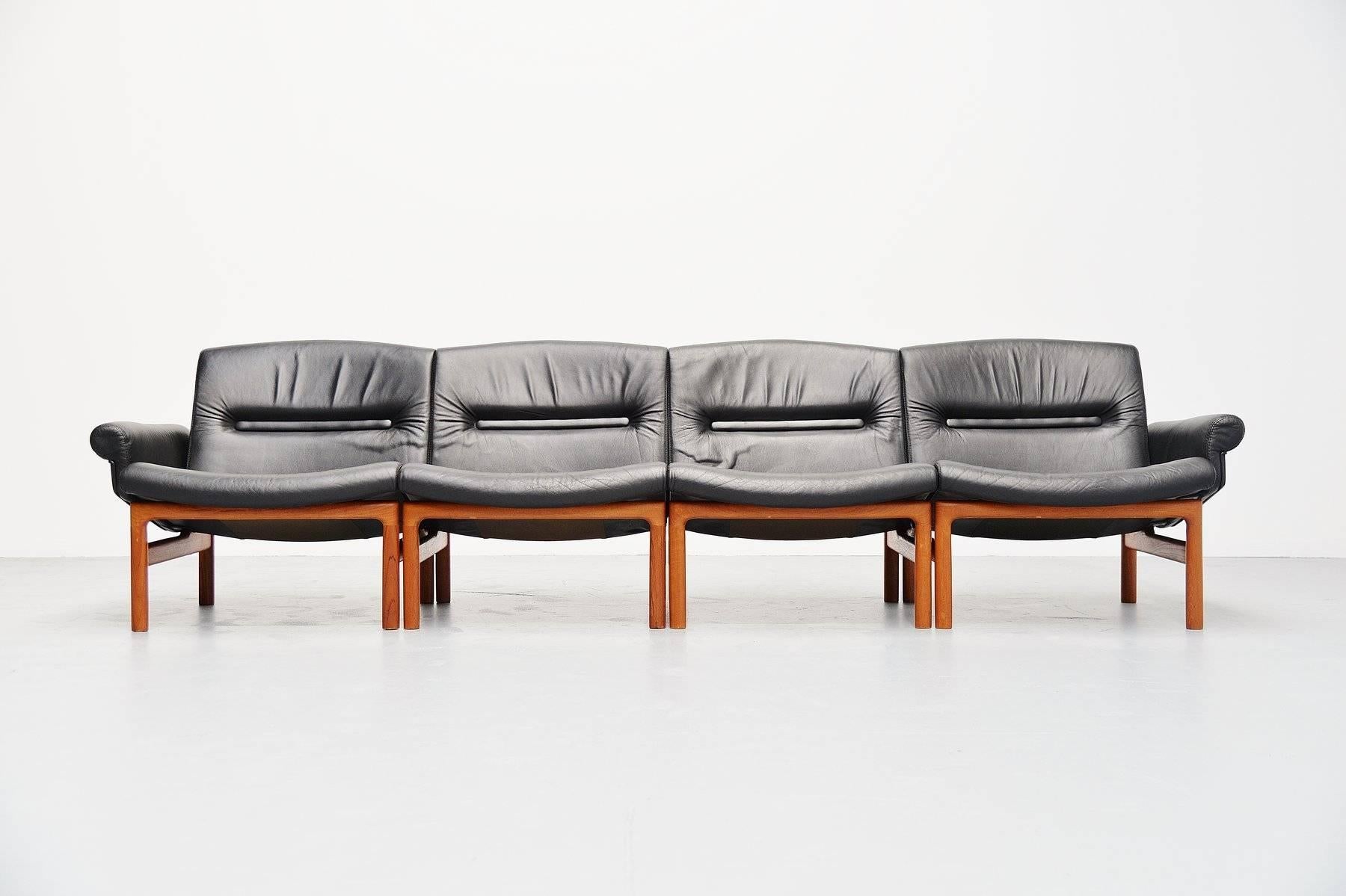 Very nice elemented sofa made by unknown manufacturer, Denmark, 1965. This sofa has four elements, two with arms and two without. Could be used as four-seat sofa of two-seat and two easy chairs. The frame is made of solid teak wood and has black
