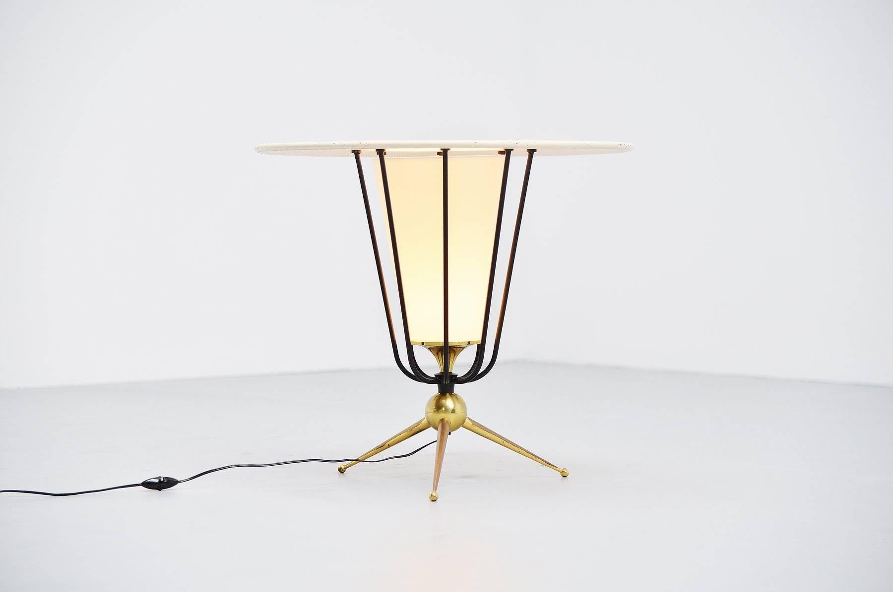 Fantastic large floor lamp possible designed by Pierre Guariche or Jacques Biny for Disderot, France, 1950. This oversized floor lamp has a brass tripod base and black lacquered spines. The die cut top is white lacquered and the shade is made of