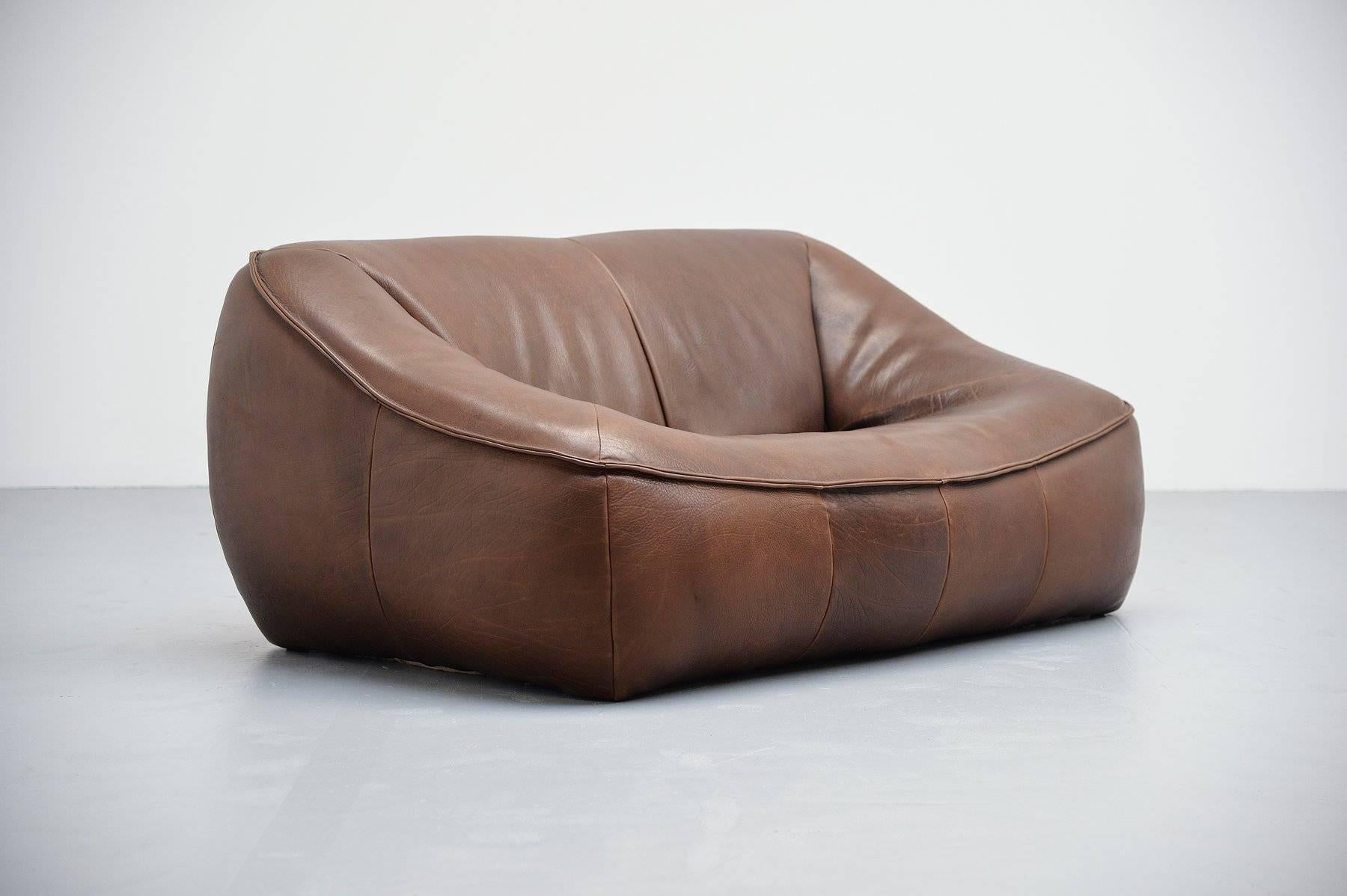 Quality leather sofa designed by Gerard Van den Berg for Montis, Holland, 1970. This sofa is made of super thick high quality buffalo leather. Very nice chocolate brown color and a nice patina from age and usage. Very nice shaped sofa and