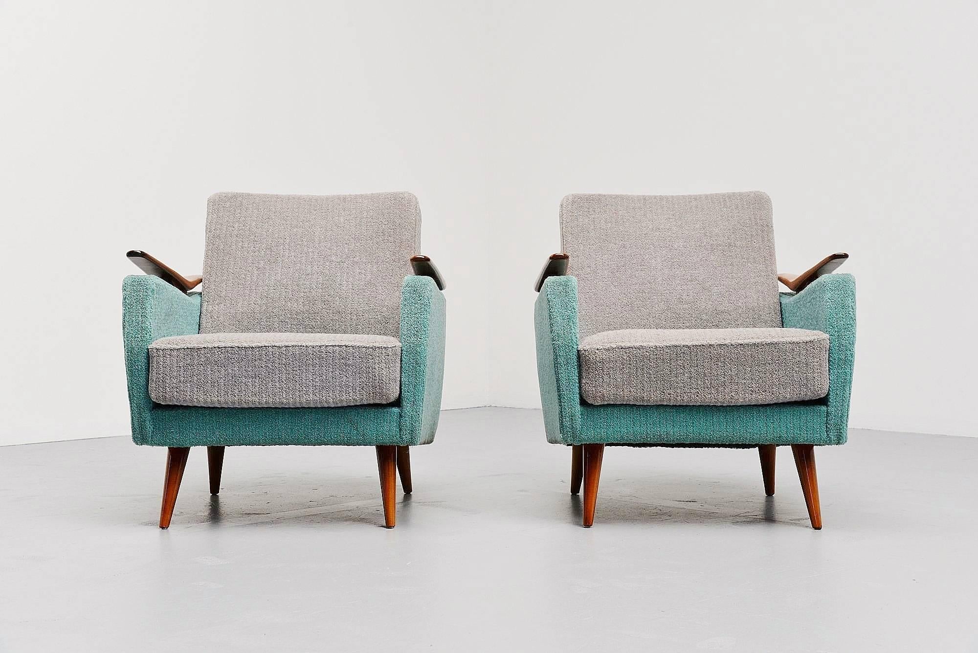 Very nice pair of club chairs in the manner of Gio Ponti, made by unknown manufacturer in Italy 1950. The chairs have original fluffy mint blue and grey fabric which is still in very good condition. Its nice in contrast with the teak wooden feet and