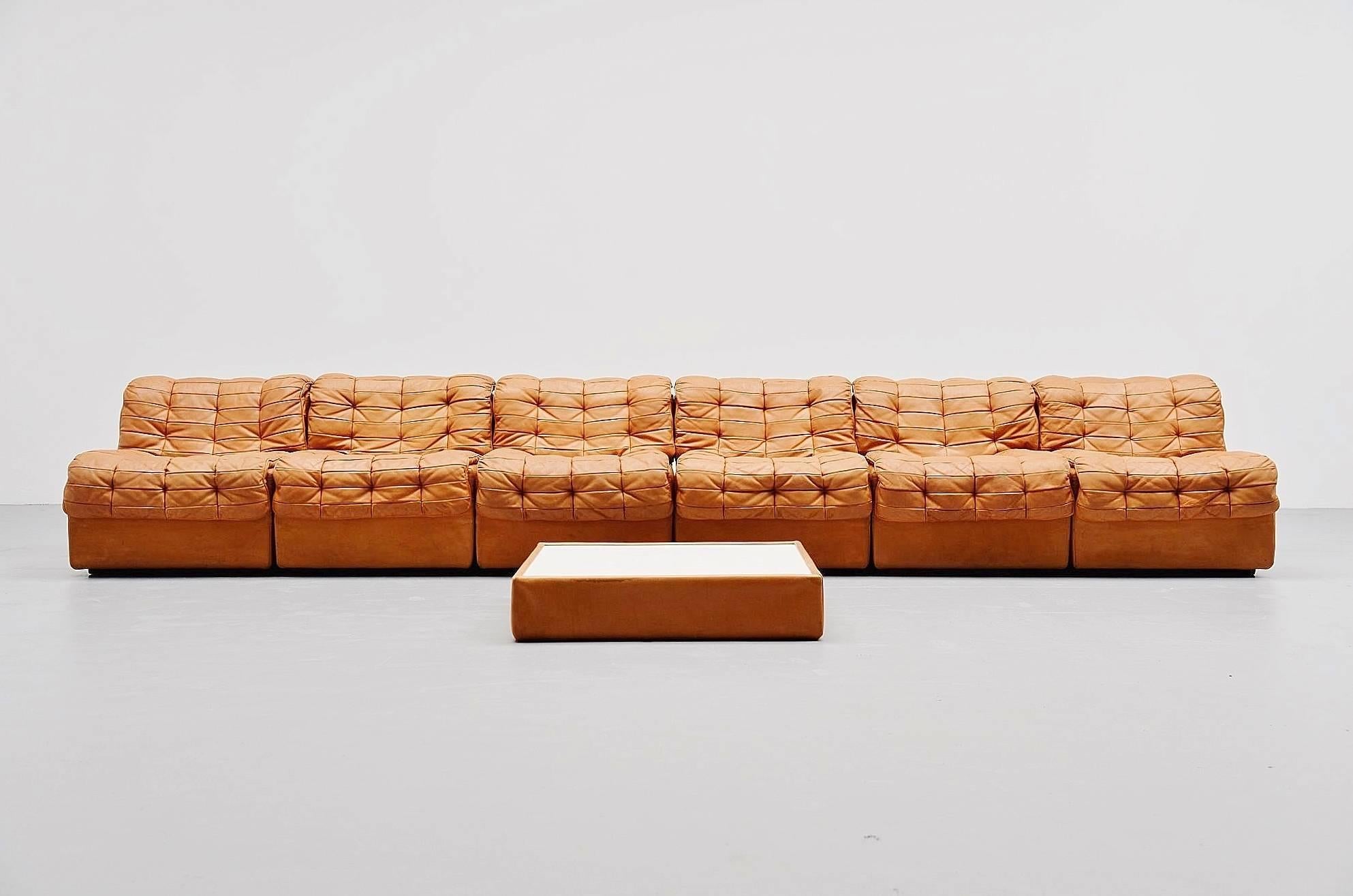 Very nice elemented DS11 sofa designed and manufactured by De Sede, Switzerland, 1970. The sofa consists of six seating elements and one coffee table that can be used between the elements or in the corner if wanted. This has a white laminated top.