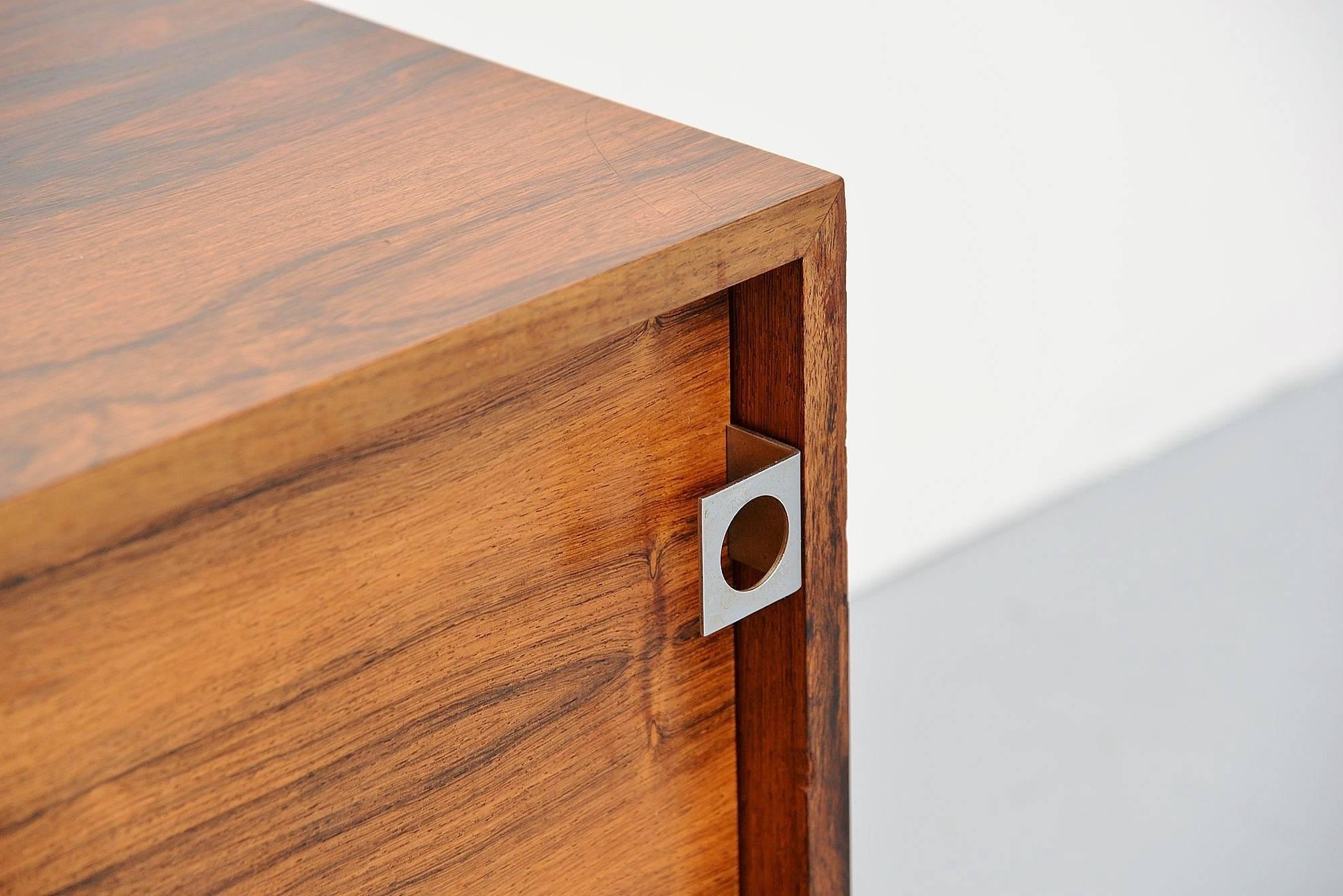 Rare small storage cabinet on wheels designed by Bodil Kjaer, manufactured by Pedersen & Son, Denmark 1959. This was made of very nice grained rosewood and was finished all-over. Easy to move because of the wheels. This small cabinet an be used with