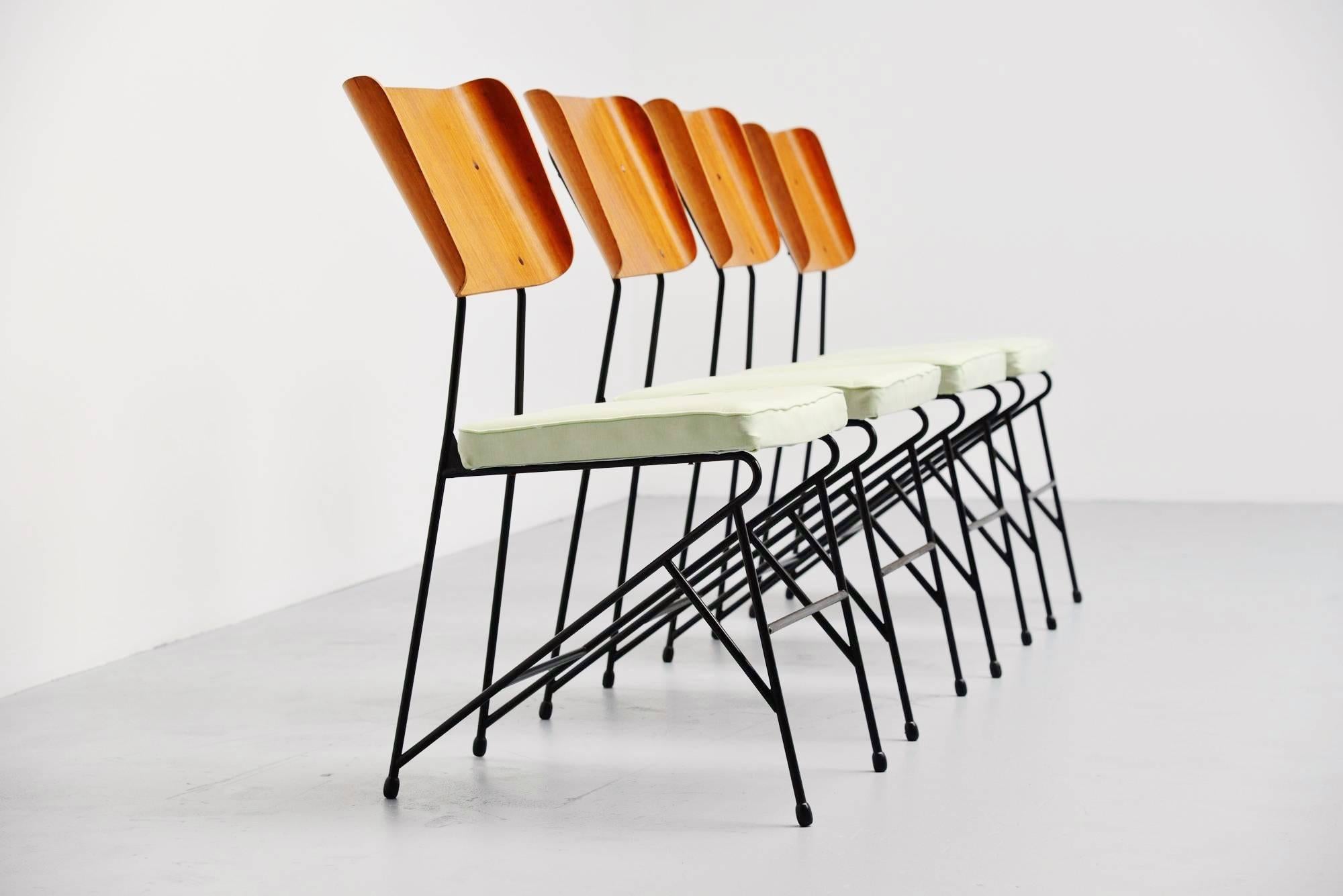 Very nice set of dining chairs designed by Carlo Ratti, manufactured by Legni Curva, Italy, 1950. These chairs have a solid metal frame, black lacquered. They have some kind of green silk upholstery and teak plywood backs. The chairs are very nice
