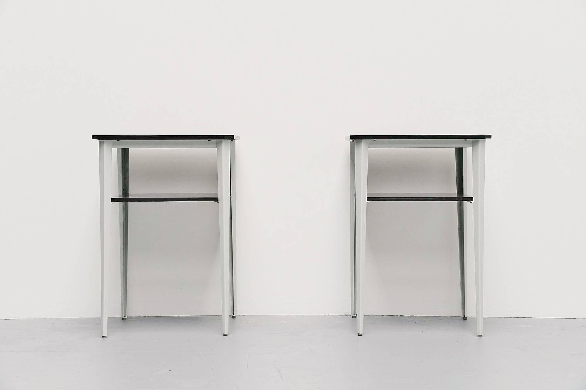 Very nice subtle and slim pair of side tables designed by Wim Rietveld, son of Gerrit Rietveld, manufactured by Ahrend de Cirkel, Holland, 1960. These tables are made of super heavy quality grey lacquered metal and has strong lines. Designed to be