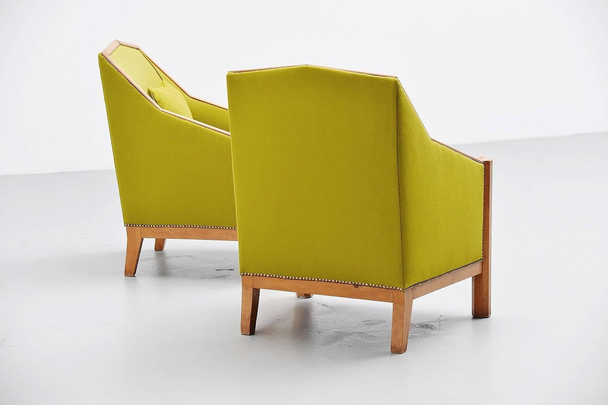 Very nice and unusual club chairs in the Amsterdams School style, Holland 1930. These Art Deco chairs have a very nice and unusual kind of church building shape. And they have very nice (close to the original color) green upholstery by Kvadrat. Very