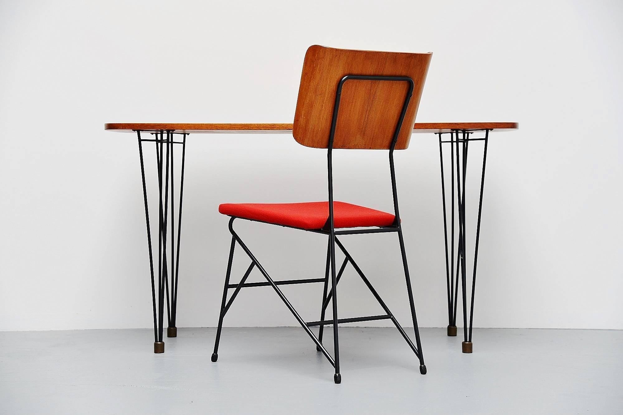 Very writing table and chair designed by Carlo Ratti, manufactured by Legni Curva, Italy, 1950. The chair has a solid metal frame, black lacquered, same as the table, but the table has brass feet. The chair has a teak plywood back and red newly